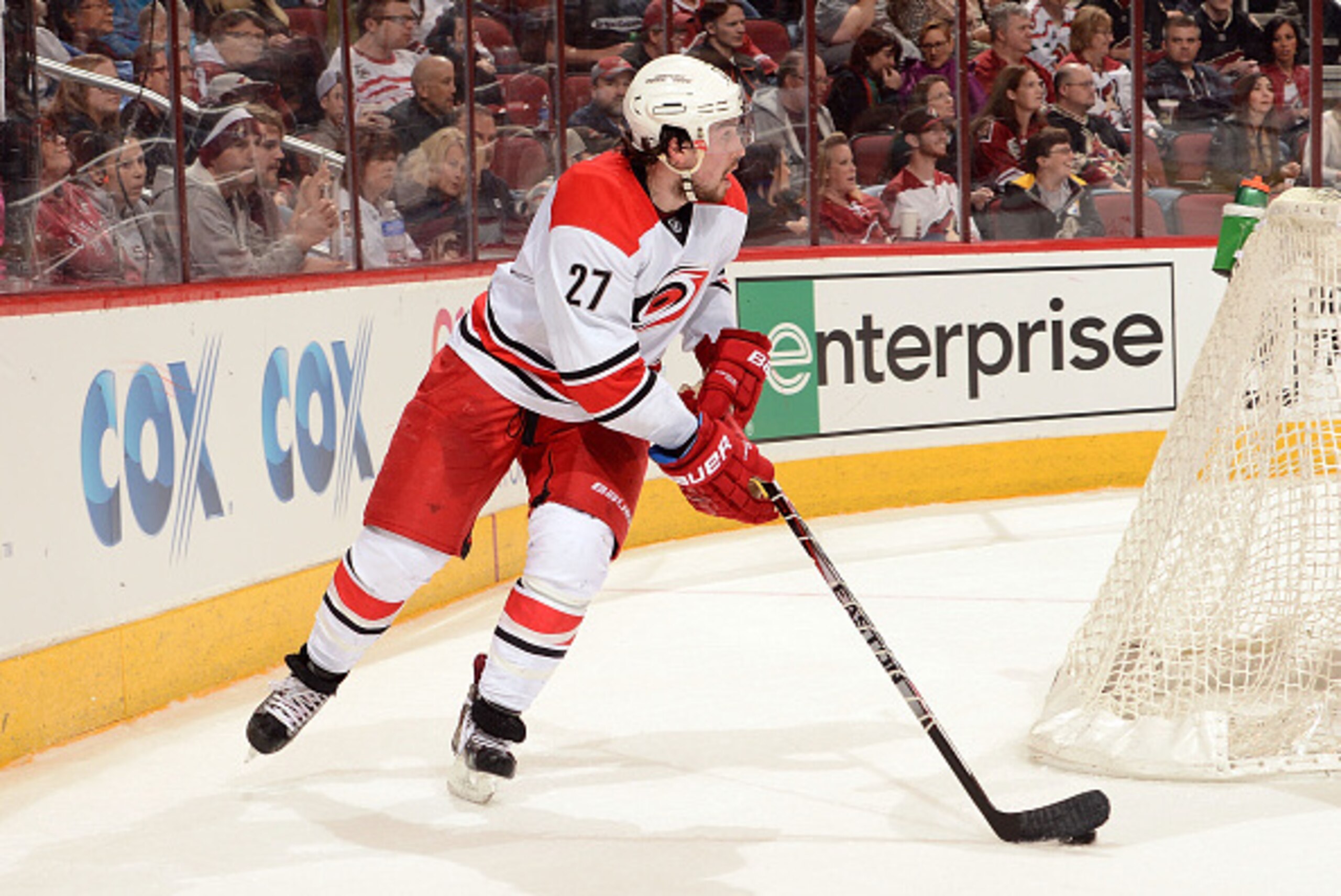 GLENDALE, AZ - FEBRUARY 05:  Justin Faulk #27 of the Carolina Hurricanes skates with the puck against the Arizona Coyotes at Gila River Arena on February 5, 2015 in Glendale, Arizona.  (Photo by Norm Hall/NHLI via Getty Images)