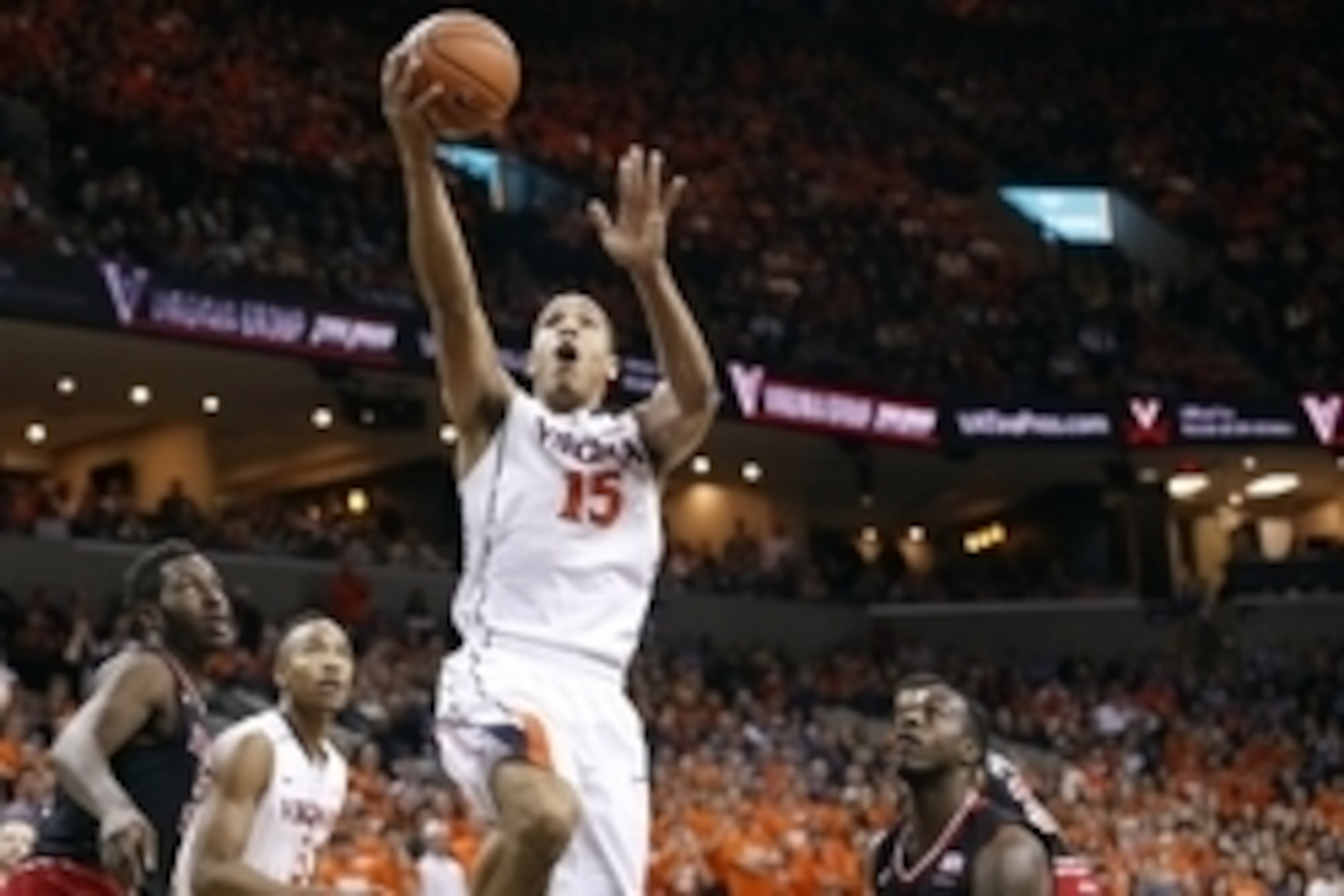 Feb 7, 2015; Charlottesville, VA, USA; Virginia Cavaliers guard Malcolm Brogdon (15) shoots the ball as Louisville Cardinals forward/center Chinanu Onuaku (32) looks on in the first half at John Paul Jones Arena. Mandatory Credit: Geoff Burke-USA TODAY Sp Feb 7, 2015; Charlottesville, VA, USA; Virginia Cavaliers guard Malcolm Brogdon (15) shoots the ball as Louisville Cardinals forward/center Chinanu Onuaku (32) looks on in the first half at John Paul Jones Arena. Mandatory Credit: Geoff Burke-USA TODAY Sp