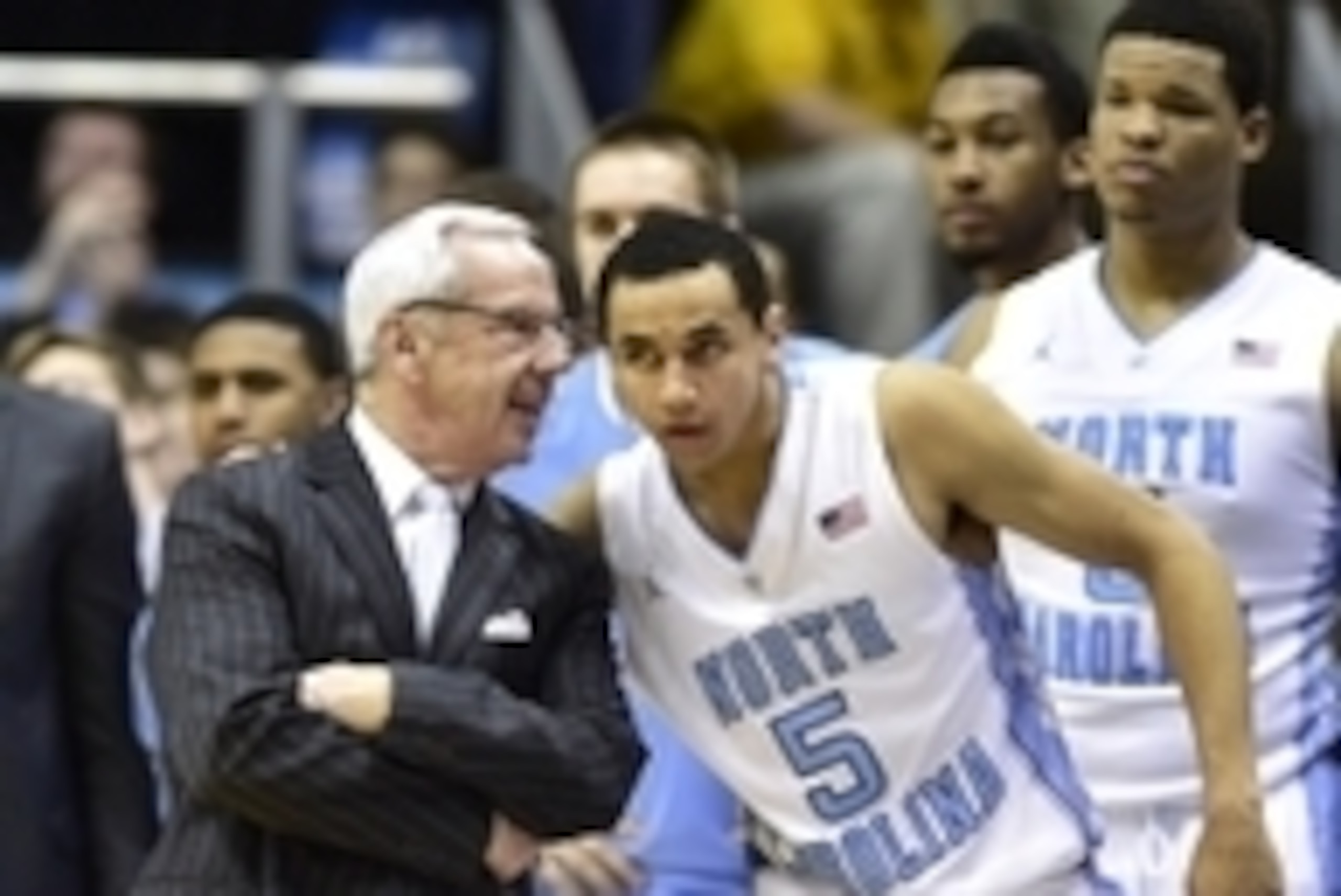 Feb 2, 2015; Chapel Hill, NC, USA; North Carolina Tar Heels head coach Roy Williams talks with guard Marcus Paige (5) in the second half. The Cavaliers defeated the Tar Heels 75-64 at Dean E. Smith Center. Mandatory Credit: Bob Donnan-USA TODAY Sports