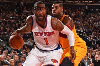 NEW YORK, NY - December 4: Amar'e Stoudemire #1 of the New York Knicks drives against Tristan Thompson #13 of the Cleveland Cavaliers on December 4, 2014 at Madison Square Garden in New York City, New York. NOTE TO USER: User expressly acknowledges and ag