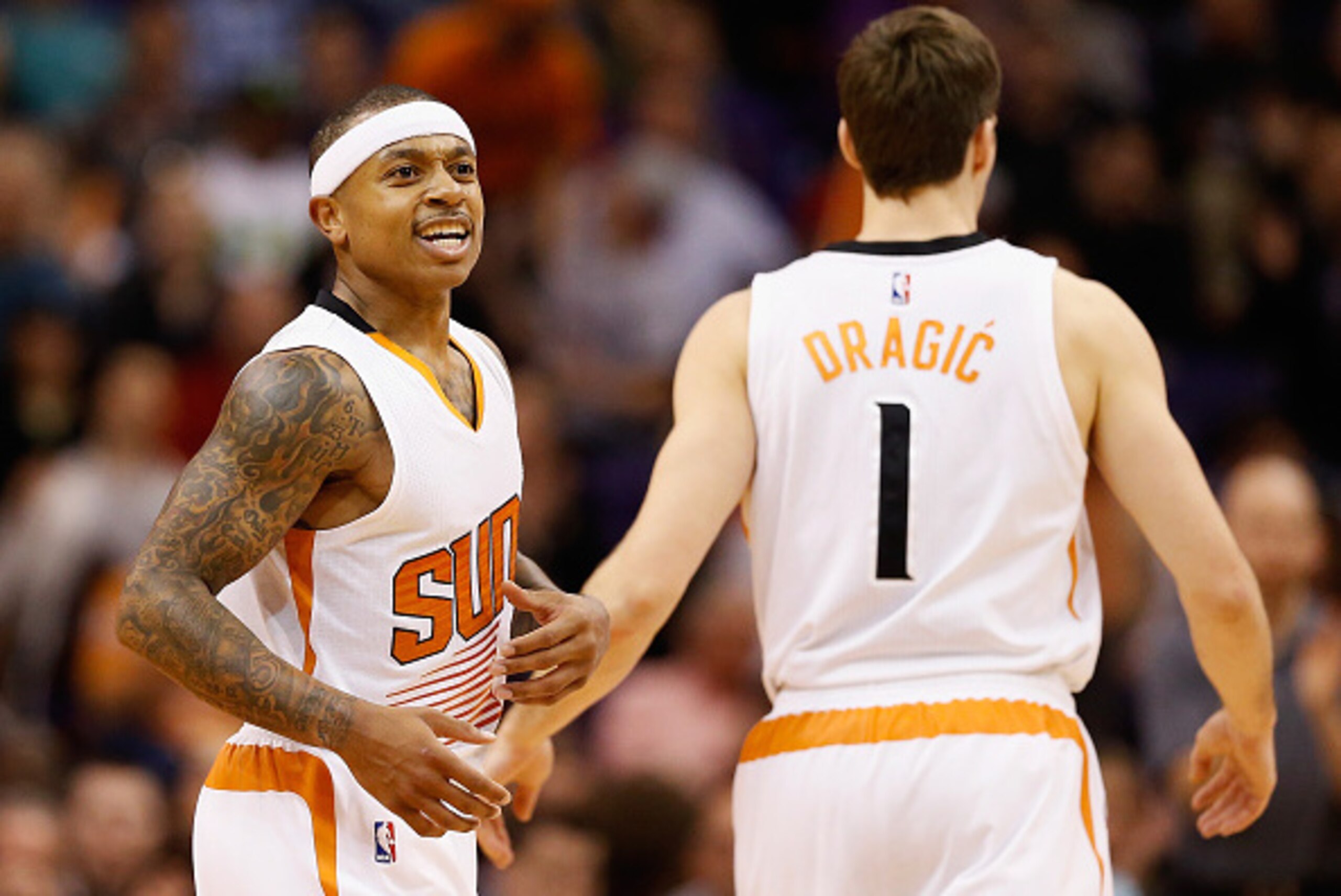 PHOENIX, AZ - JANUARY 21:  Isaiah Thomas #3 of the Phoenix Suns celebrates with Goran Dragic #1 after scoring against the Portland Trail Blazers during the second half of the NBA game at US Airways Center on January 21, 2015 in Phoenix, Arizona. The Suns 