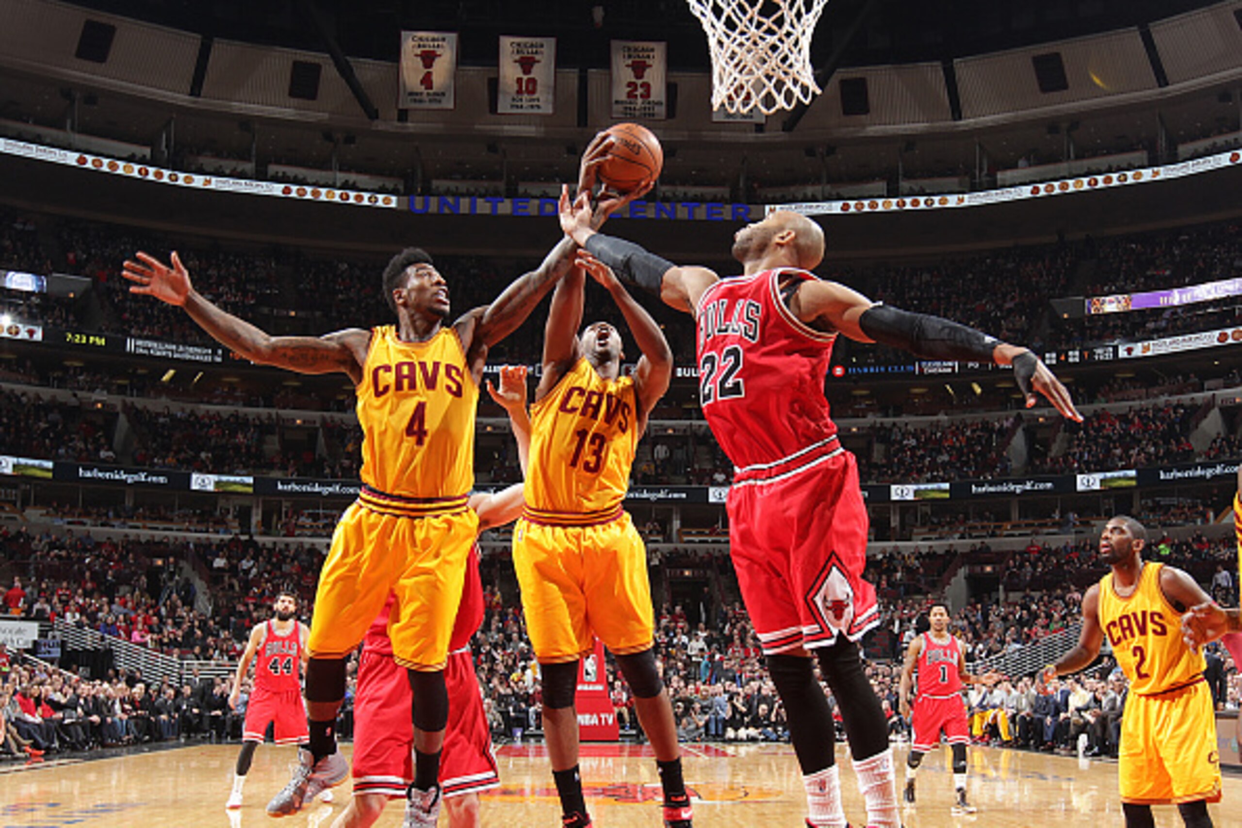 CHICAGO, IL - FEBRUARY 12: Iman Shumpert #4 and Tristan Thompson #13 of the Cleveland Cavaliers go up for a rebound against Taj Gibson #22 of the Chicago Bulls at the United Center on February 12, 2015 in Chicago, Illinois. NOTE TO USER: User expressly ac