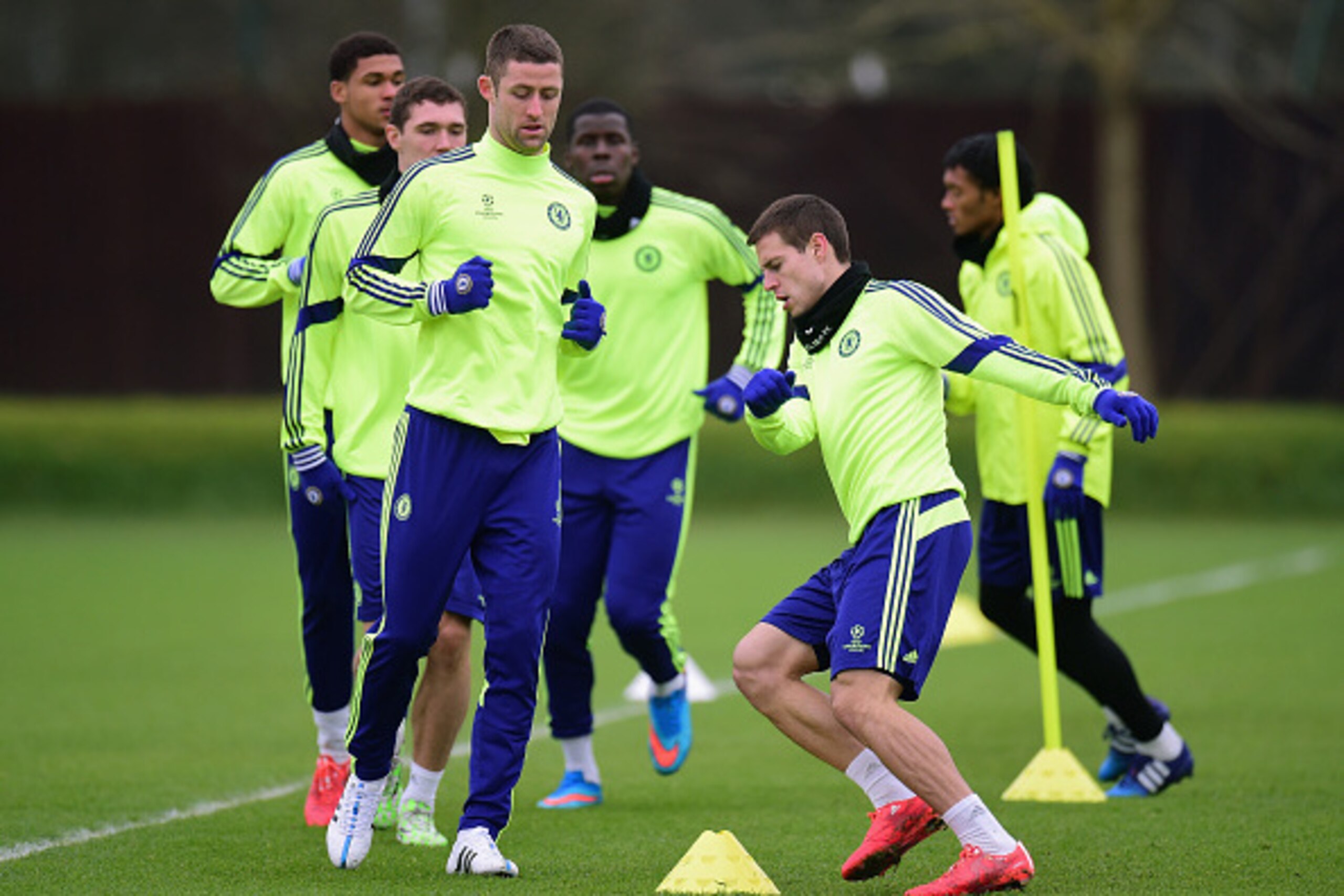 LONDON, ENGLAND - FEBRUARY 16:  Gary Cahill (L) and Cesar Azpilicueta of Chelsea run drills during a Chelsea training session ahead of the UEFA Champions League round of 16 match against Paris Saint-Germain at Cobham Training Centre on February 16, 2015 i