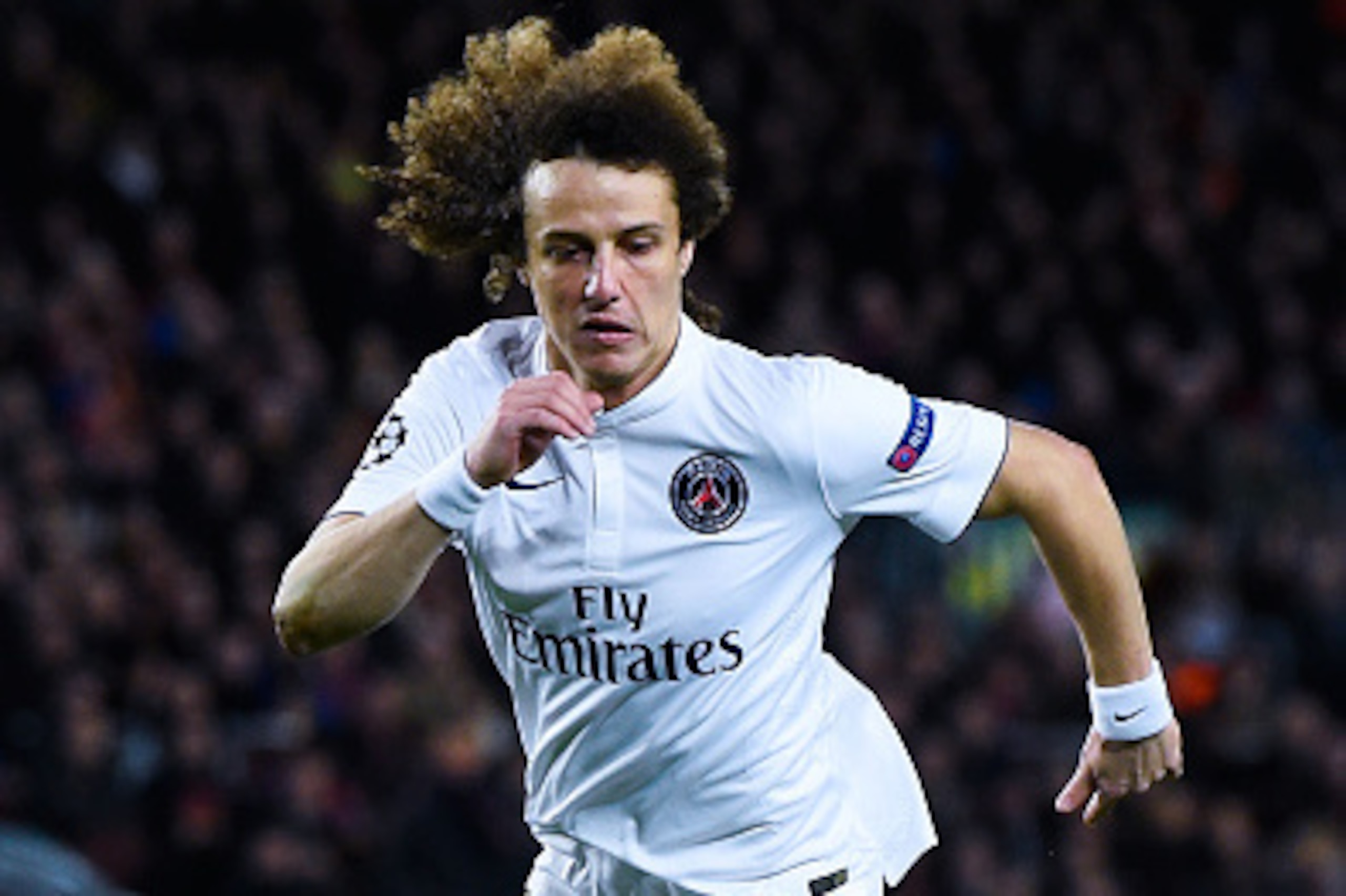 BARCELONA, SPAIN - DECEMBER 10:  David Luiz of Paris Saint-Germain FC runs with the ball during the UEFA Champions League group F match between FC Barcelona and Paris Saint-Germanin FC at Camp Nou Stadium on December 10, 2014 in Barcelona, Spain.  (Photo 