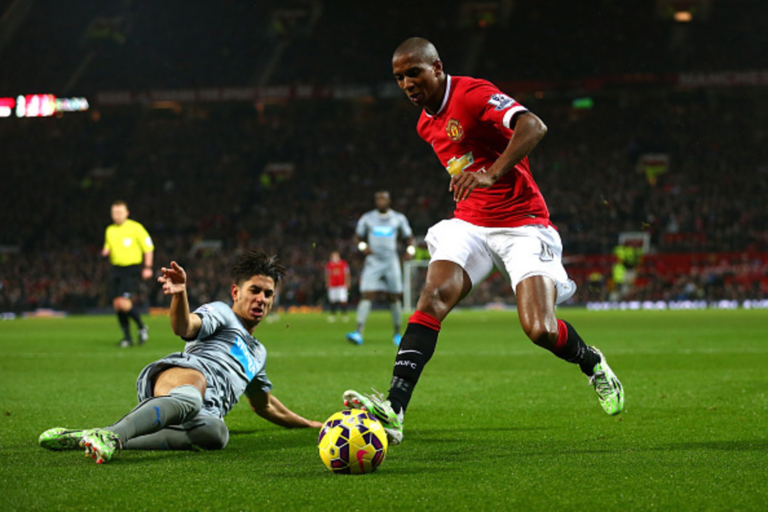MANCHESTER, ENGLAND - DECEMBER 26:  Ashley Young of Manchester United is challenged by Ayoze Perez of Newcastle United during the Barclays Premier League match between Manchester United and Newcastle United at Old Trafford on December 26, 2014 in Manchest