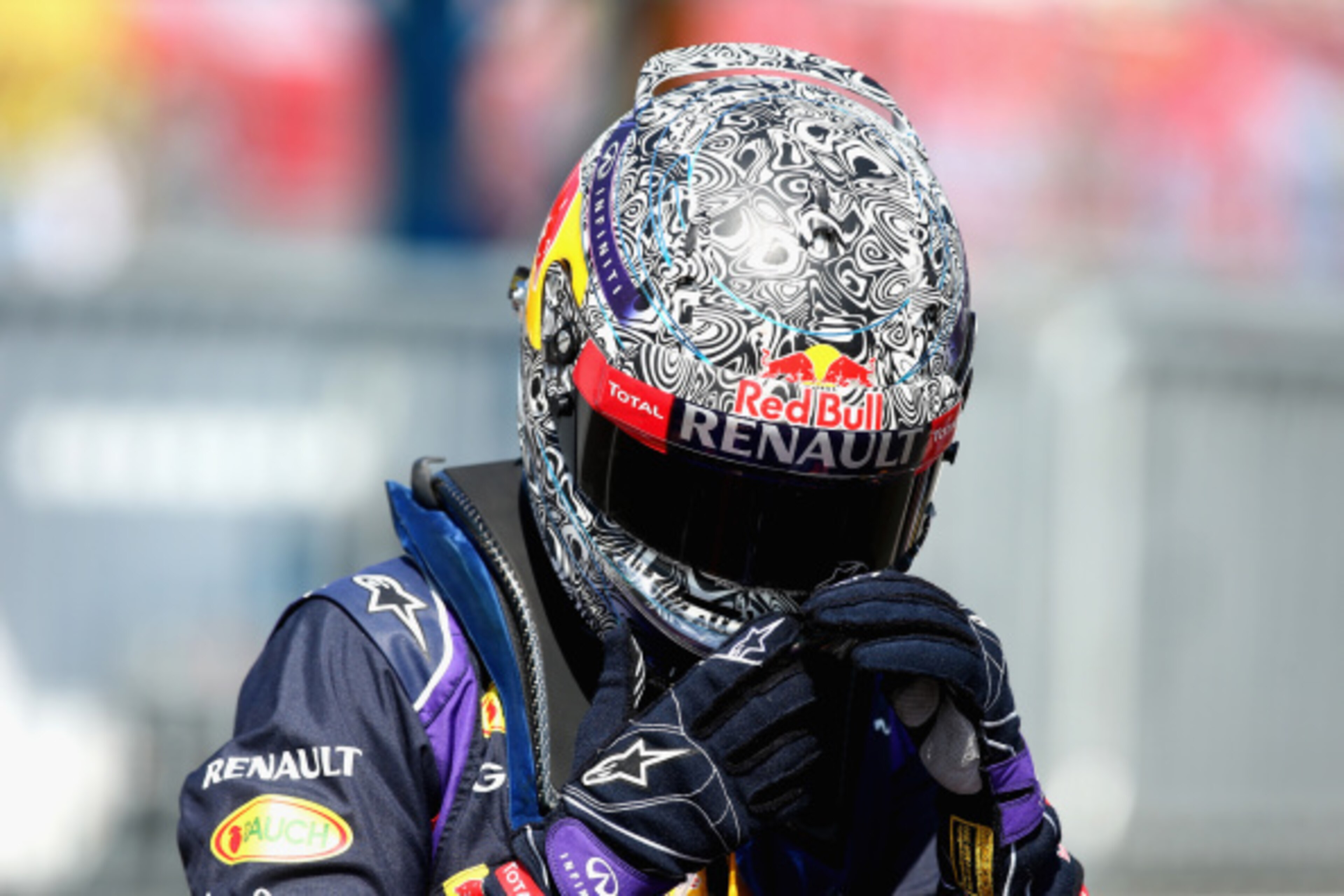 MONZA, ITALY - SEPTEMBER 06:  Sebastian Vettel of Germany and Infiniti Red Bull Racing walks into the team garage  during Practice ahead of the F1 Grand Prix of Italy at Autodromo di Monza on September 6, 2014 in Monza, Italy.  (Photo by Paul Gilham/Getty