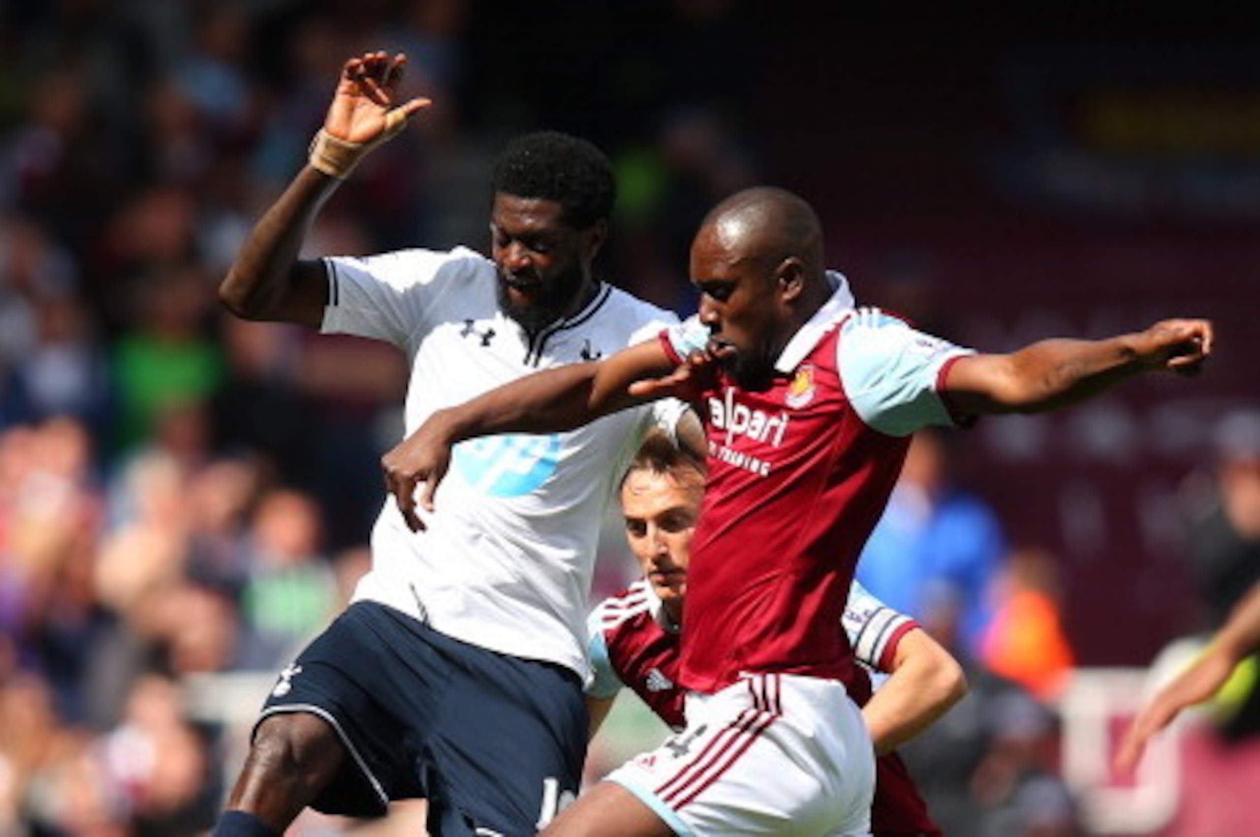 LONDON, ENGLAND - MAY 03: Emmanuel Adebayor of Spurs and Carlton Cole of West Ham compete for the ball during the Barclays Premier League match between West Ham United and Tottenham Hotspur at Boleyn Ground on May 3, 2014 in London, England. (Photo by B LONDON, ENGLAND - MAY 03: Emmanuel Adebayor of Spurs and Carlton Cole of West Ham compete for the ball during the Barclays Premier League match between West Ham United and Tottenham Hotspur at Boleyn Ground on May 3, 2014 in London, England. (Photo by B