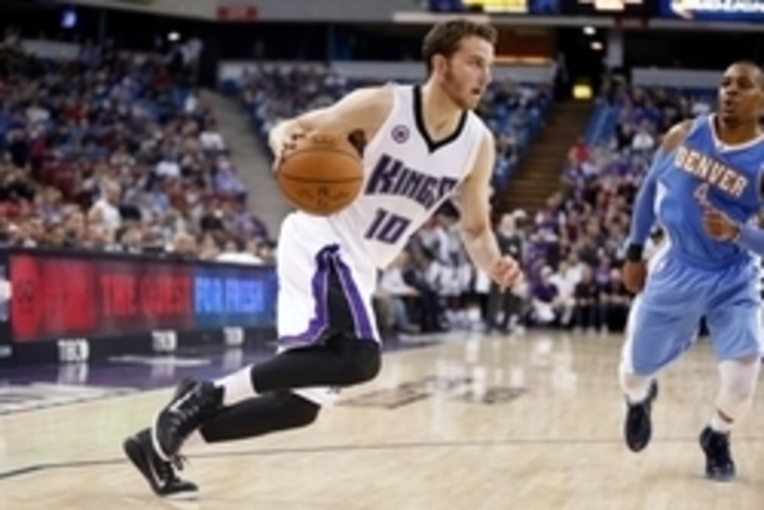 Nov 5, 2014; Sacramento, CA, USA; Sacramento Kings guard Nik Stauskas (10) drives in against the Denver Nuggets during the fourth quarter at Sleep Train Arena. The Sacramento Kings defeated the Denver Nuggets 131-109. Mandatory Credit: Kelley L Cox-USA TO
