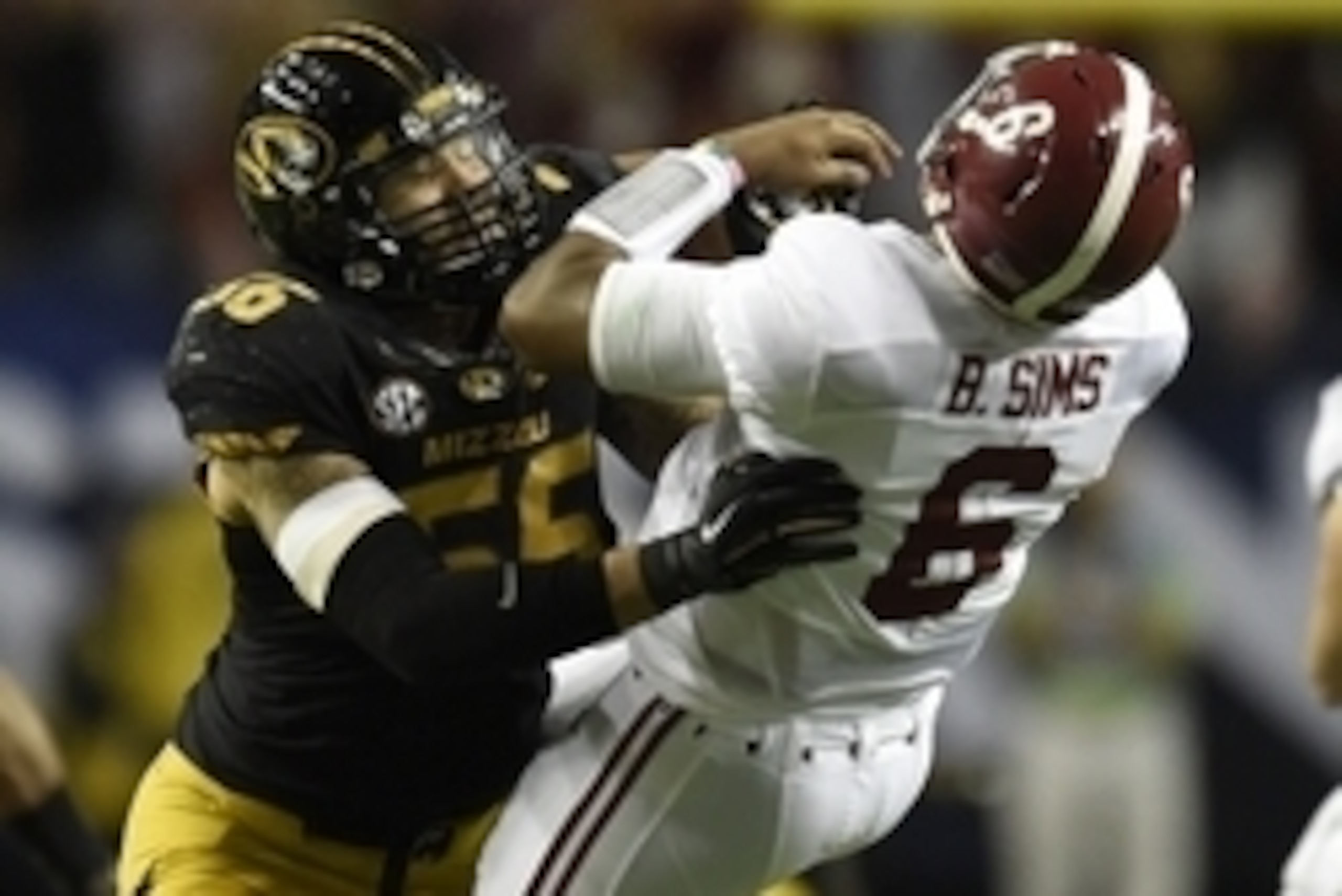 Dec 6, 2014; Atlanta, GA, USA; Missouri Tigers defensive lineman Shane Ray (56) tackles Alabama Crimson Tide quarterback Blake Sims (6) during the second quarter of the 2014 SEC Championship Game at the Georgia Dome. The play caused Ray to be ejected from