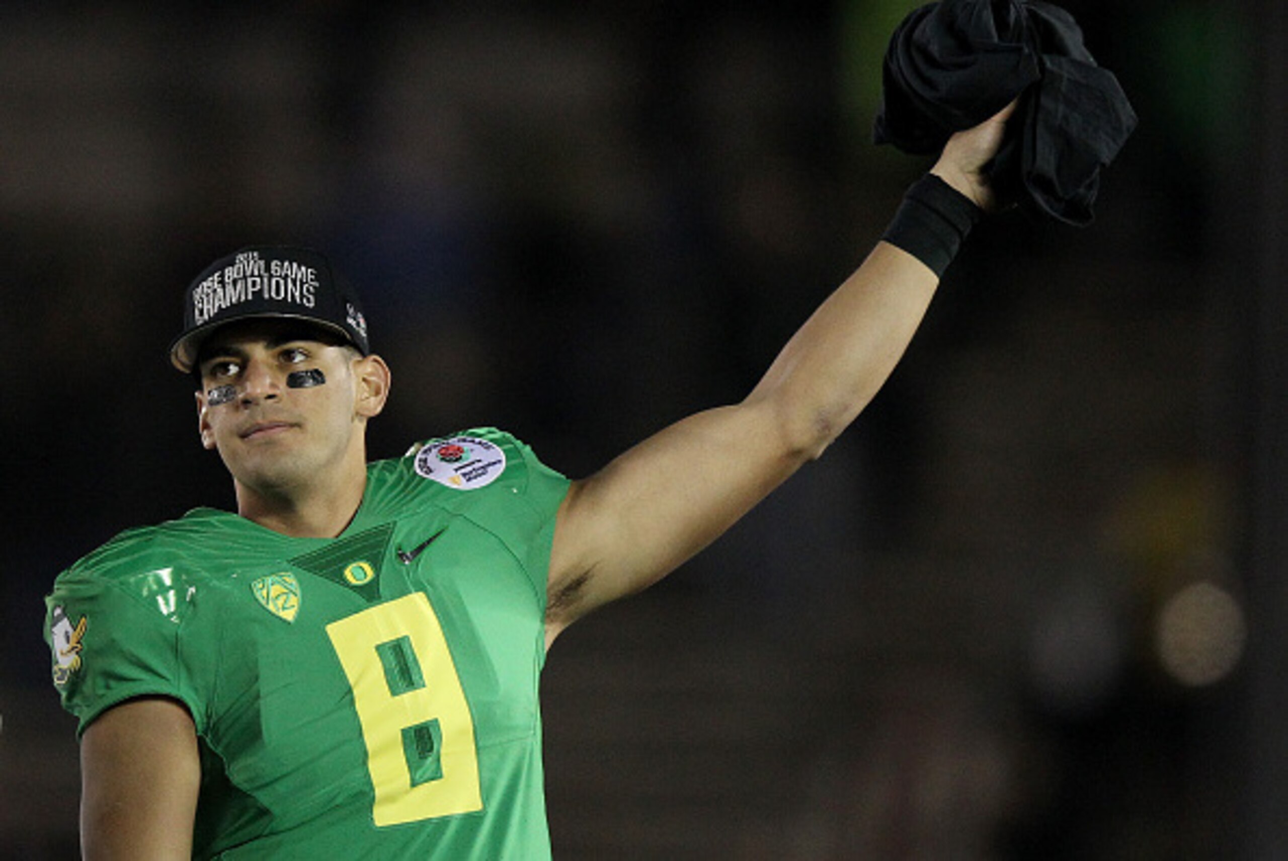 PASADENA, CA - JANUARY 01:  Quarterback Marcus Mariota #8 of the Oregon Ducks reacts after defeating the Florida State Seminoles 59-20 in the College Football Playoff Semifinal at the Rose Bowl Game presented by Northwestern Mutual at the Rose Bowl on Jan
