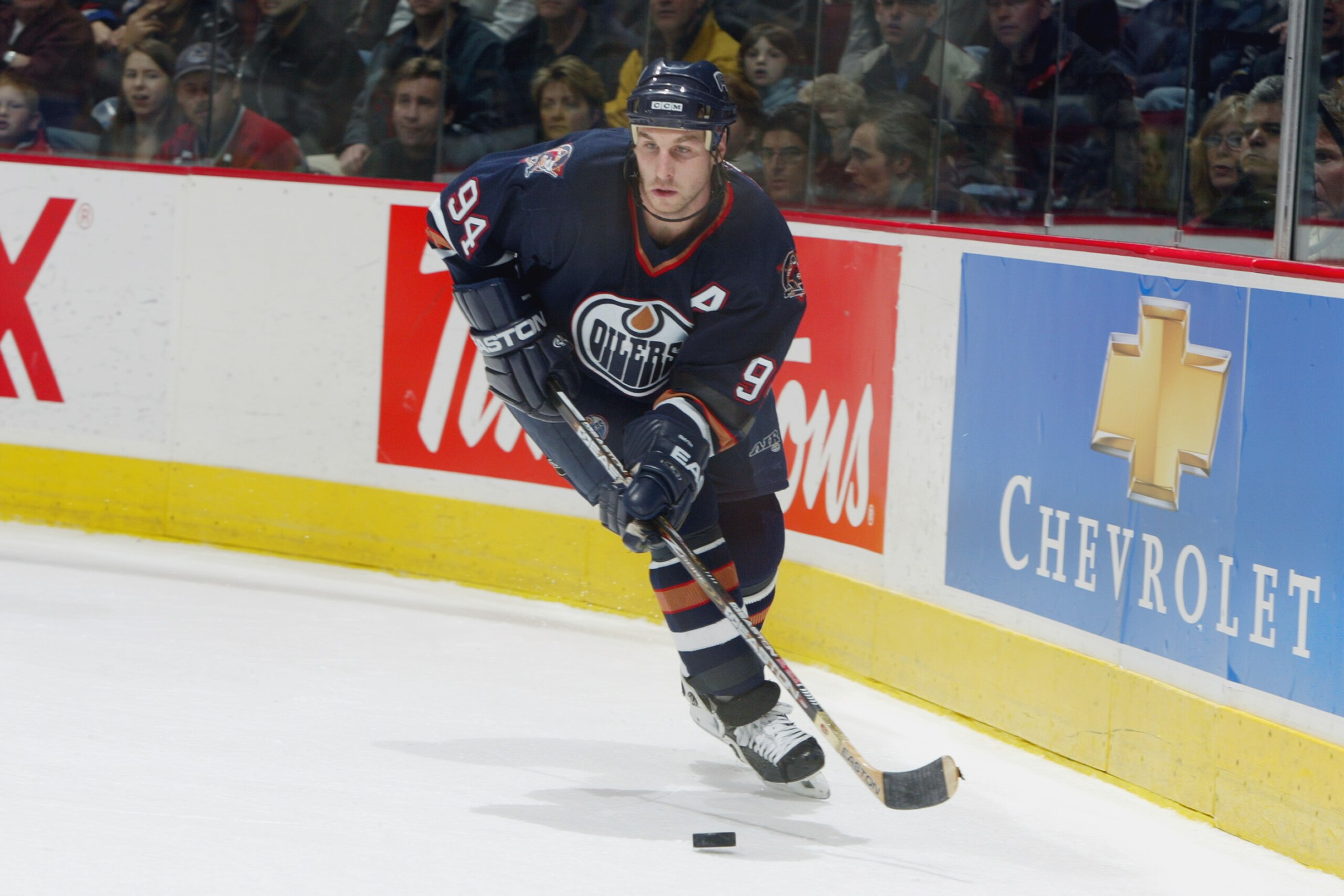 VANCOUVER - DECEMBER 21: Ryan Smyth #94 of the Edmonton Oilers skates with the puck during the NHL game against the Vancouver Canucks at GM Palace on December 21, 2002 in Vancouver, Canada. The Canucks won in overtime 4-3. (Photo by Jeff Vinnick/Getty VANCOUVER - DECEMBER 21: Ryan Smyth #94 of the Edmonton Oilers skates with the puck during the NHL game against the Vancouver Canucks at GM Palace on December 21, 2002 in Vancouver, Canada. The Canucks won in overtime 4-3. (Photo by Jeff Vinnick/Getty