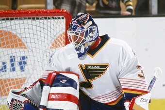 BOSTON, MA - 1990's: Grant Fuhr #30 of the St. Louis Blues tends goal in pre game warm up before game against the Boston Bruins at the Fleet Center.  (Photo by Steve Babineau/NHLI via Getty Images)