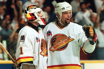 11 JUN 1994: CANUCKS DEFENSEMAN BRENT HEDIGAN CELEBRATES WITH GOALTENDER KIRK MCLEAN AFTER DEFEATING THE RANGERS, 4-1, IN GAME SIX OF THE STANLEY CUP FINALS IN VANCOUVER, BRITISH COLUMBIA. THE WIN TIES THE SERIES AT 3-3. GAME SEVEN WILL BE PLAYED IN NEW Y