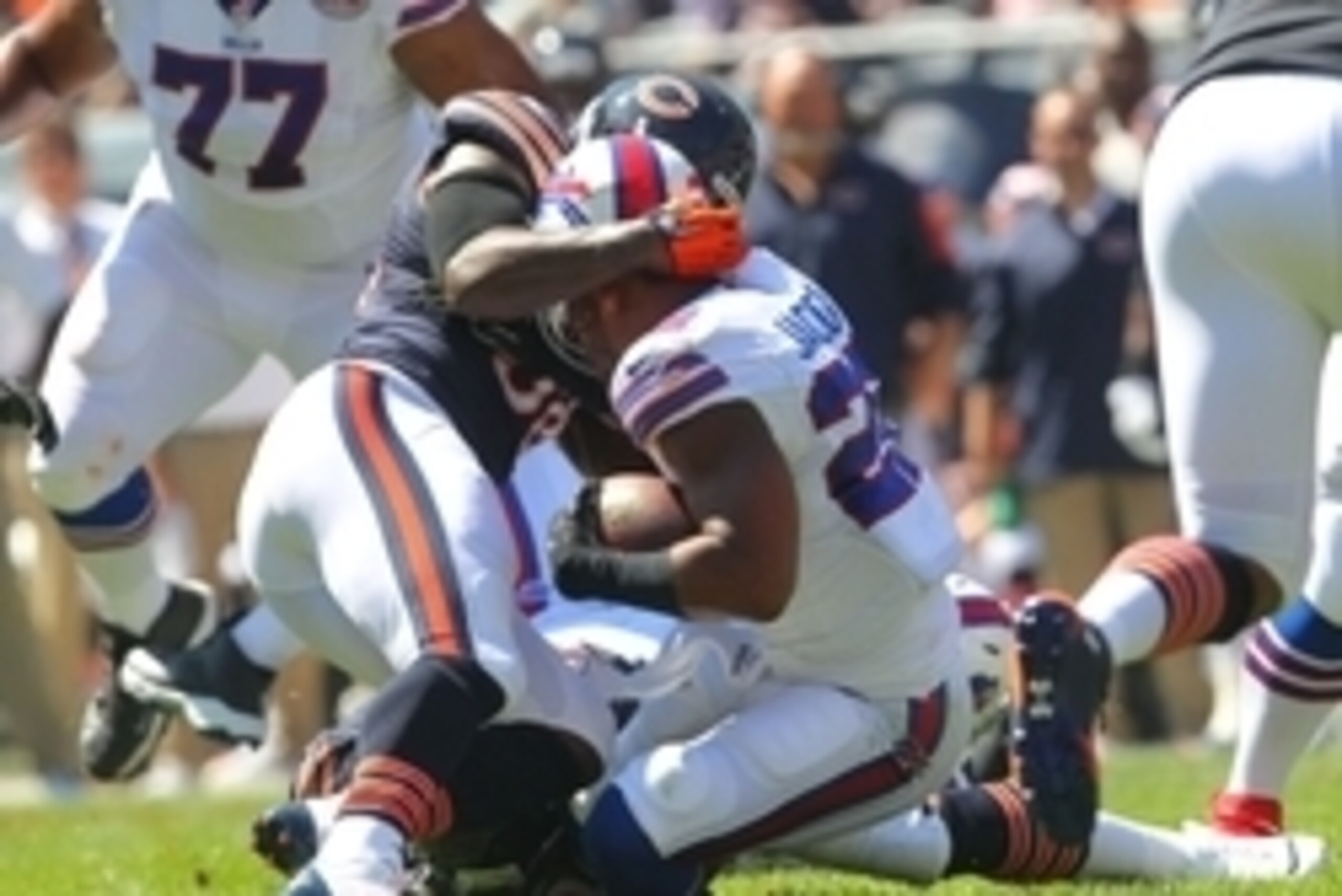 Sep 7, 2014; Chicago, IL, USA; (Editors note: caption correction) Buffalo Bills running back Fred Jackson (22) loses his helmet while being tackled by Chicago Bears defensive end Lamarr Houston (99) during the first quarter at Soldier Field. Mandatory Cre