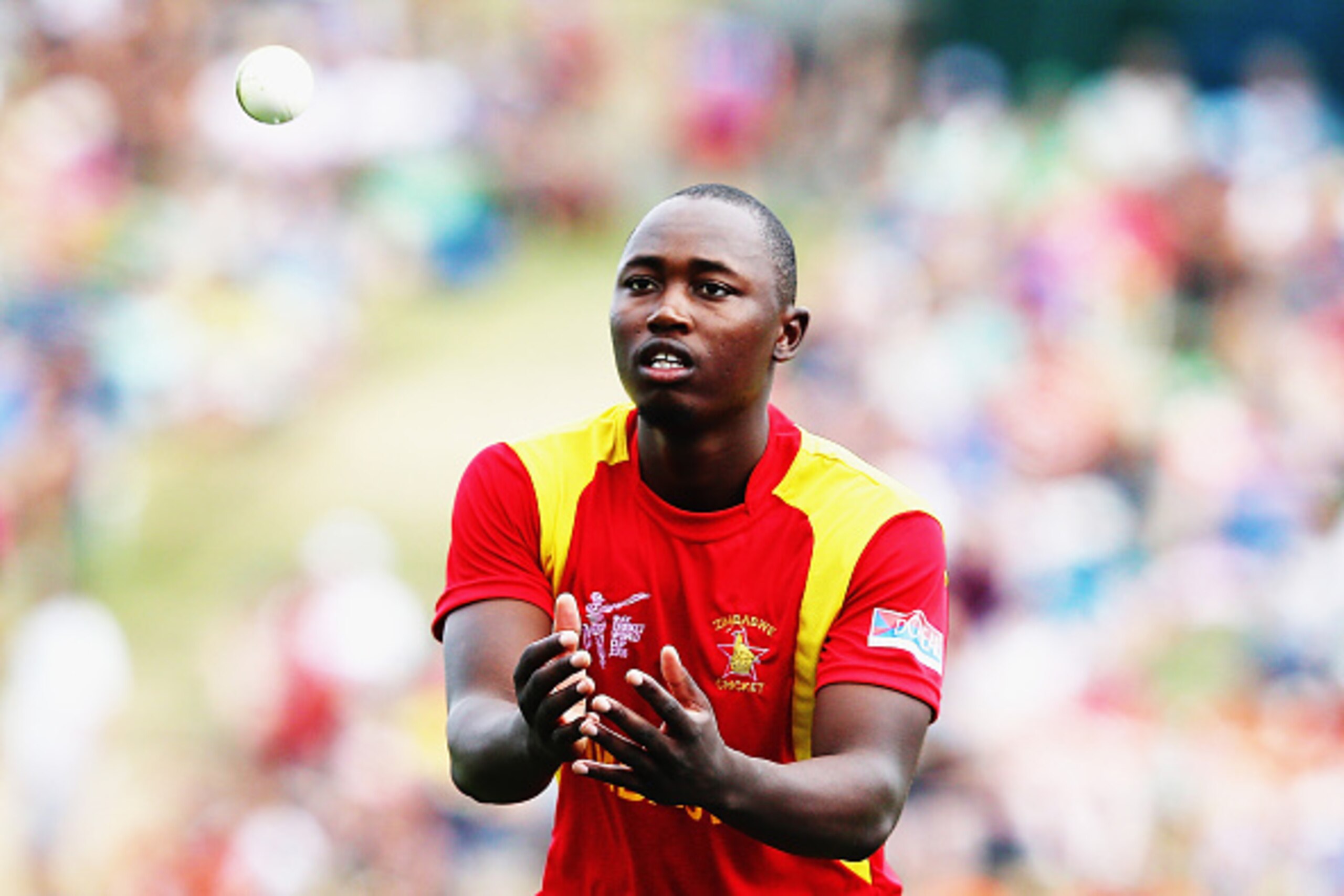 HAMILTON, NEW ZEALAND - FEBRUARY 15: Tendai Chatara of Zimbabwe fields during the 2015 ICC Cricket World Cup match between South Africa and Zimbabwe at Seddon Park on February 15, 2015 in Hamilton, New Zealand.  (Photo by Hannah Peters/Getty Images)