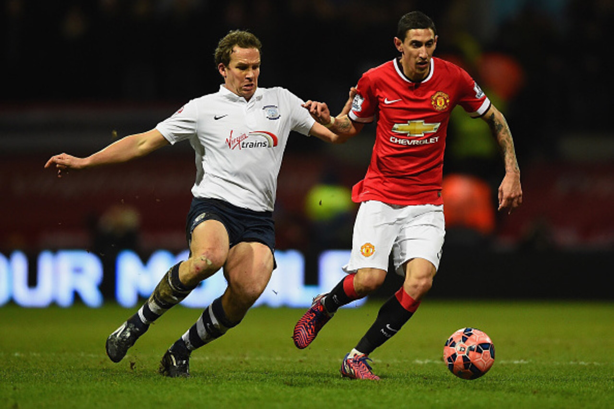 PRESTON, ENGLAND - FEBRUARY 16:  Kevin Davies of Preston North End and Angel di Maria of Manchester United compete for the ball during the FA Cup Fifth round match between Preston North End and Manchester United at Deepdale on February 16, 2015 in Preston