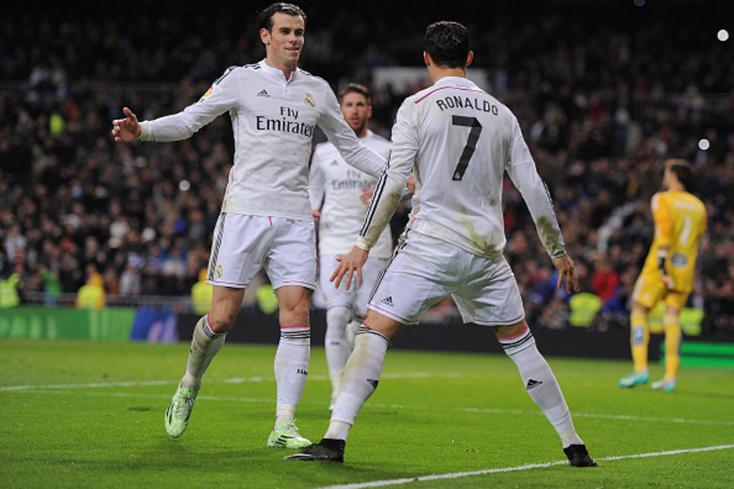 MADRID, SPAIN - DECEMBER 06:  Cristiano Ronaldo of Real Madrid celebrates with Gareth Bale after scoring Real's opening goal during the La Liga match between Real Madrid CF and Celta Vigo at Estadio Santiago Bernabeu on December 6, 2014 in Madrid, Spain. 