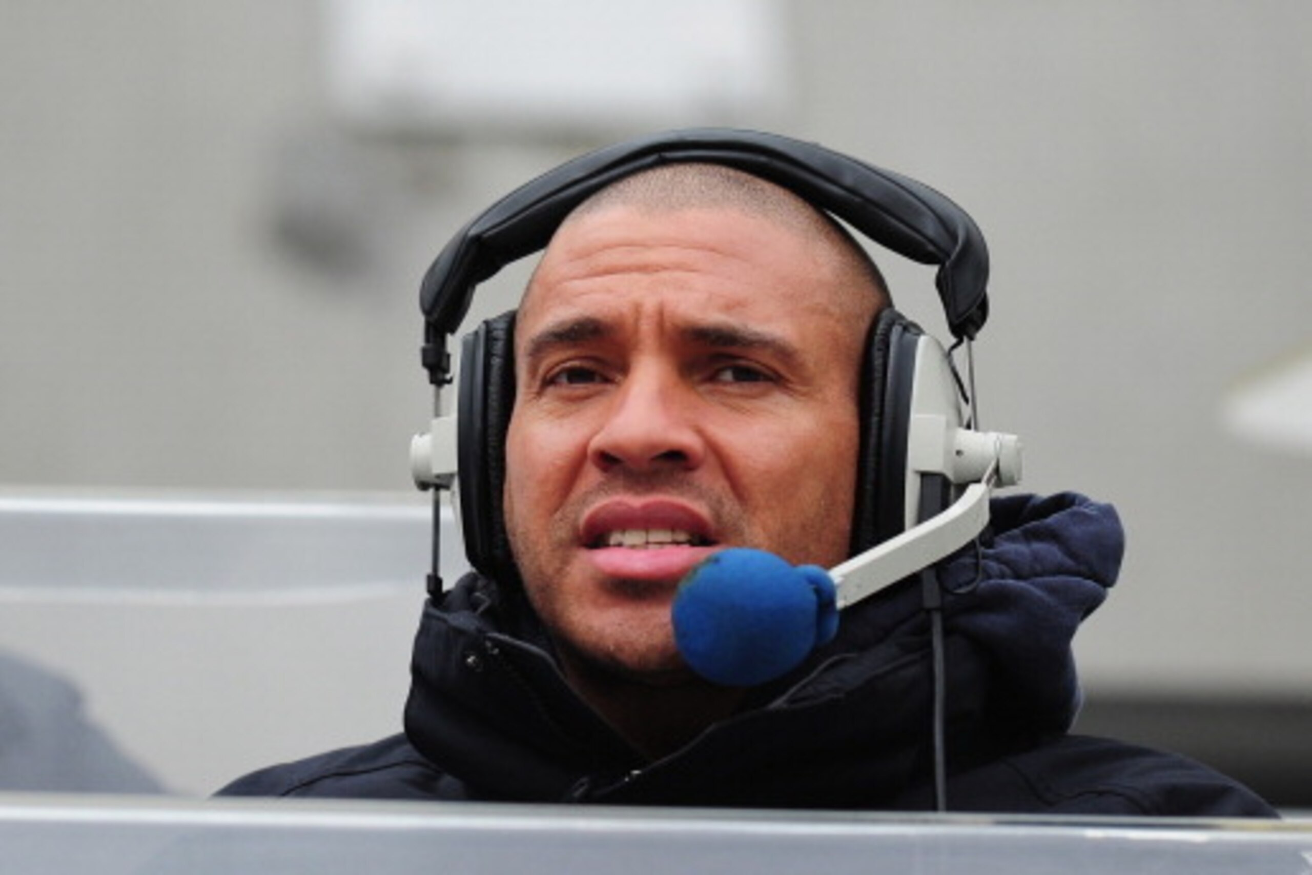 NEWCASTLE UPON TYNE, ENGLAND - FEBRUARY 23:  Radio presenter Stan Collymore looks on before the Barclays Premier League match between Newcastle United and  Aston Villa at St James' Park on February 23, 2014 in Newcastle upon Tyne, England.  (Photo by Stu 