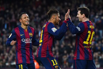 BARCELONA, SPAIN - FEBRUARY 15:  Lionel Messi of FC Barcelona celebrates with his teammate Neymar of FC Barcelona after scoring his team's fourth goal from the penalty spot during the La Liga match between FC Barcelona and Levante UD at Camp Nou on Februa