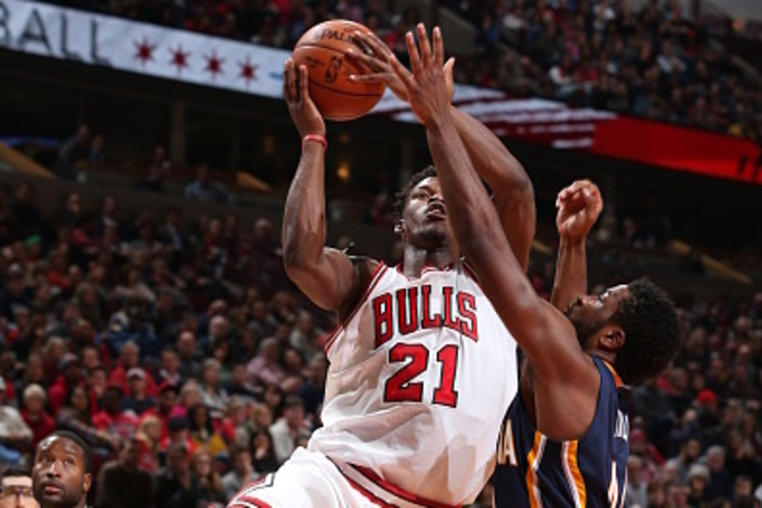 CHICAGO, IL - NOVEMBER 15:  Jimmy Butler #21 of the Chicago Bulls takes a shot against the Indiana Pacers on November 15, 2014 at the United Center in Chicago, Illinois. NOTE TO USER: User expressly acknowledges and agrees that, by downloading and or usin