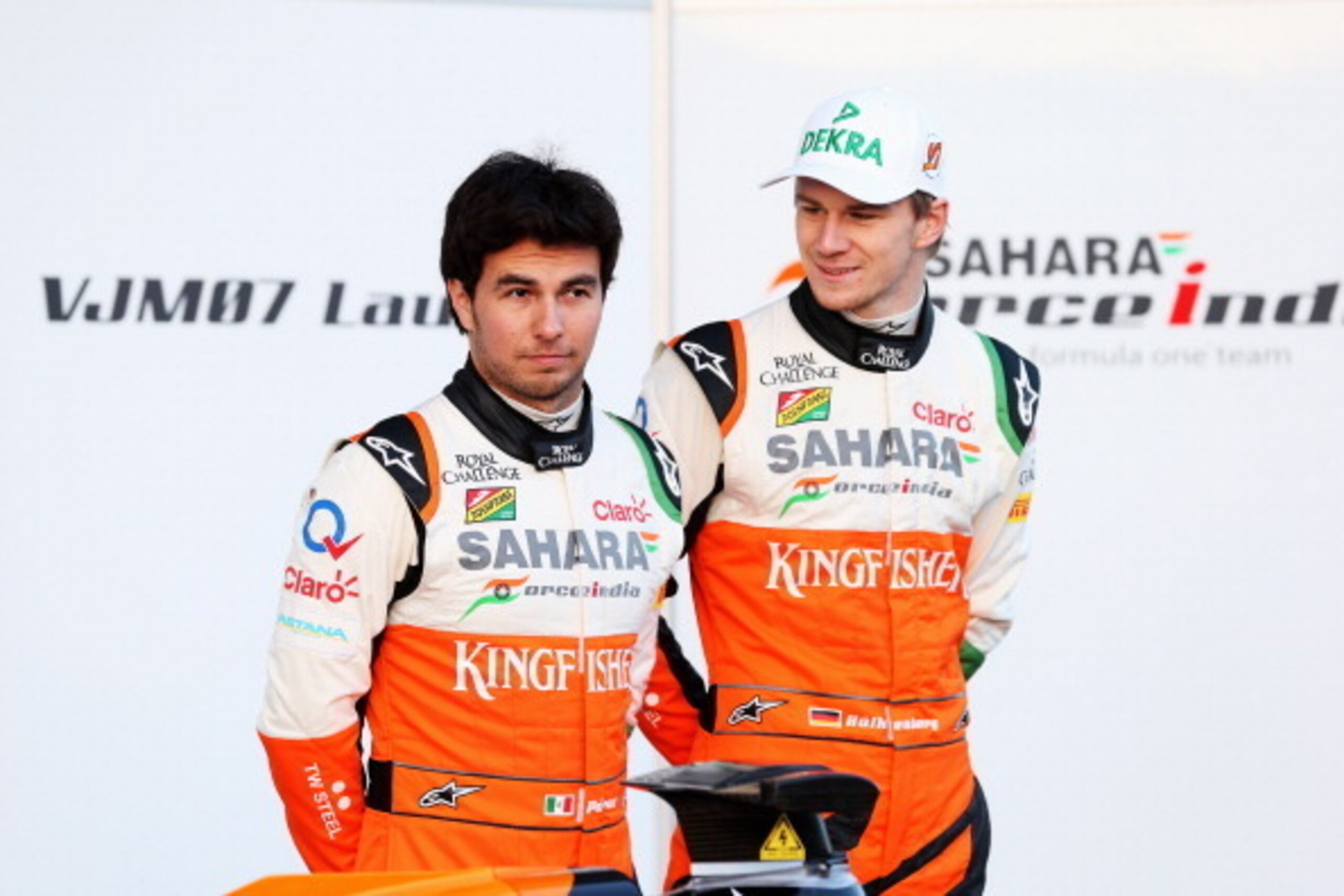 JEREZ DE LA FRONTERA, SPAIN - JANUARY 28:  (L-R) Force India drivers Sergio Perez of Mexico and Nico Hulkenberg of Germany attend the launch of the new VJM07 during day one of Formula One Winter Testing at the Circuito de Jerez on January 28, 2014 in Jere