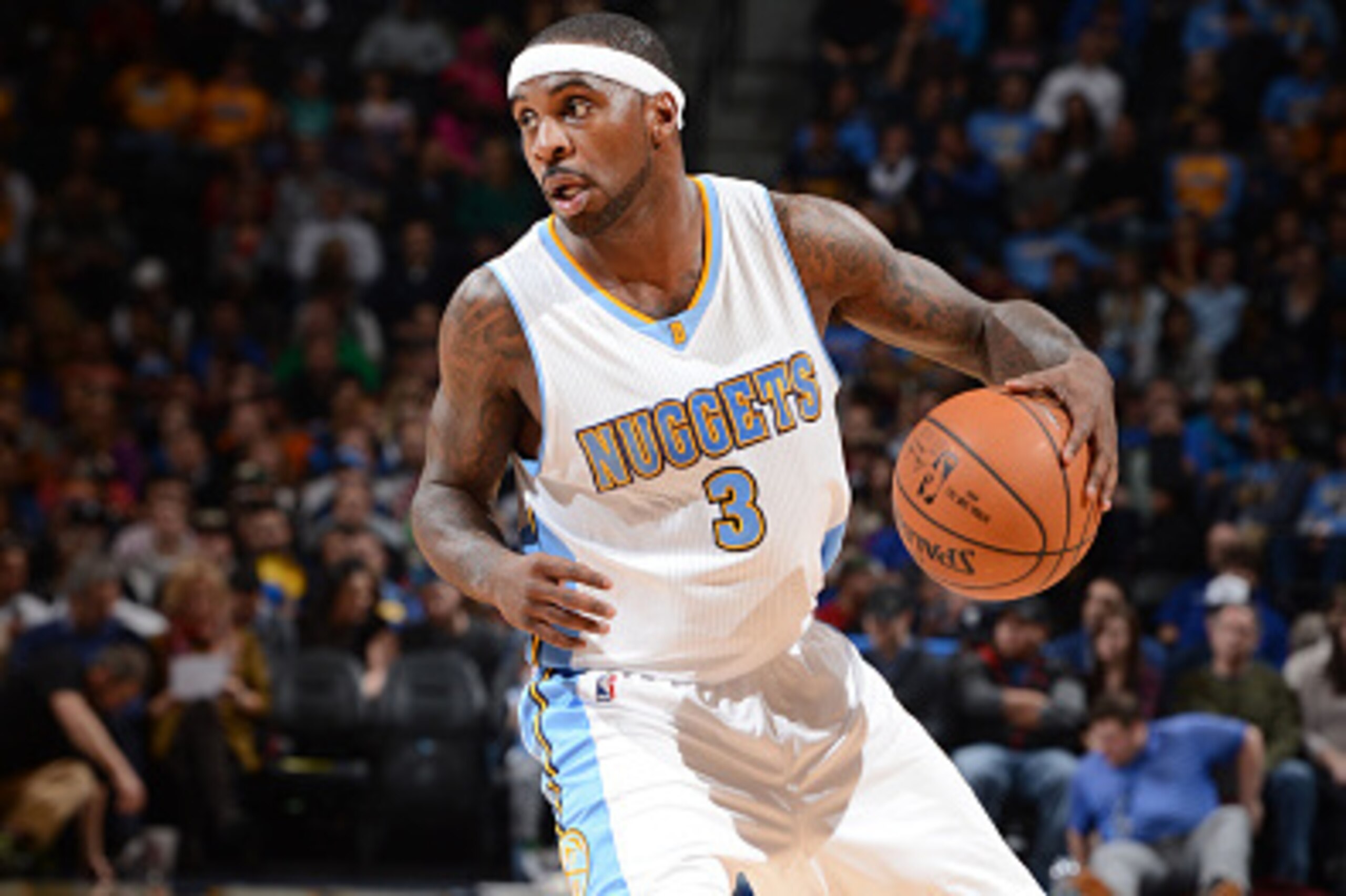 DENVER, CO -  JANUARY 14: Ty Lawson #3 of the Denver Nuggets looks to move the ball against the Dallas Mavericks during the game on January 14, 2015 at Pepsi Center in Denver, Colorado . NOTE TO USER: User expressly acknowledges and agrees that, by downlo