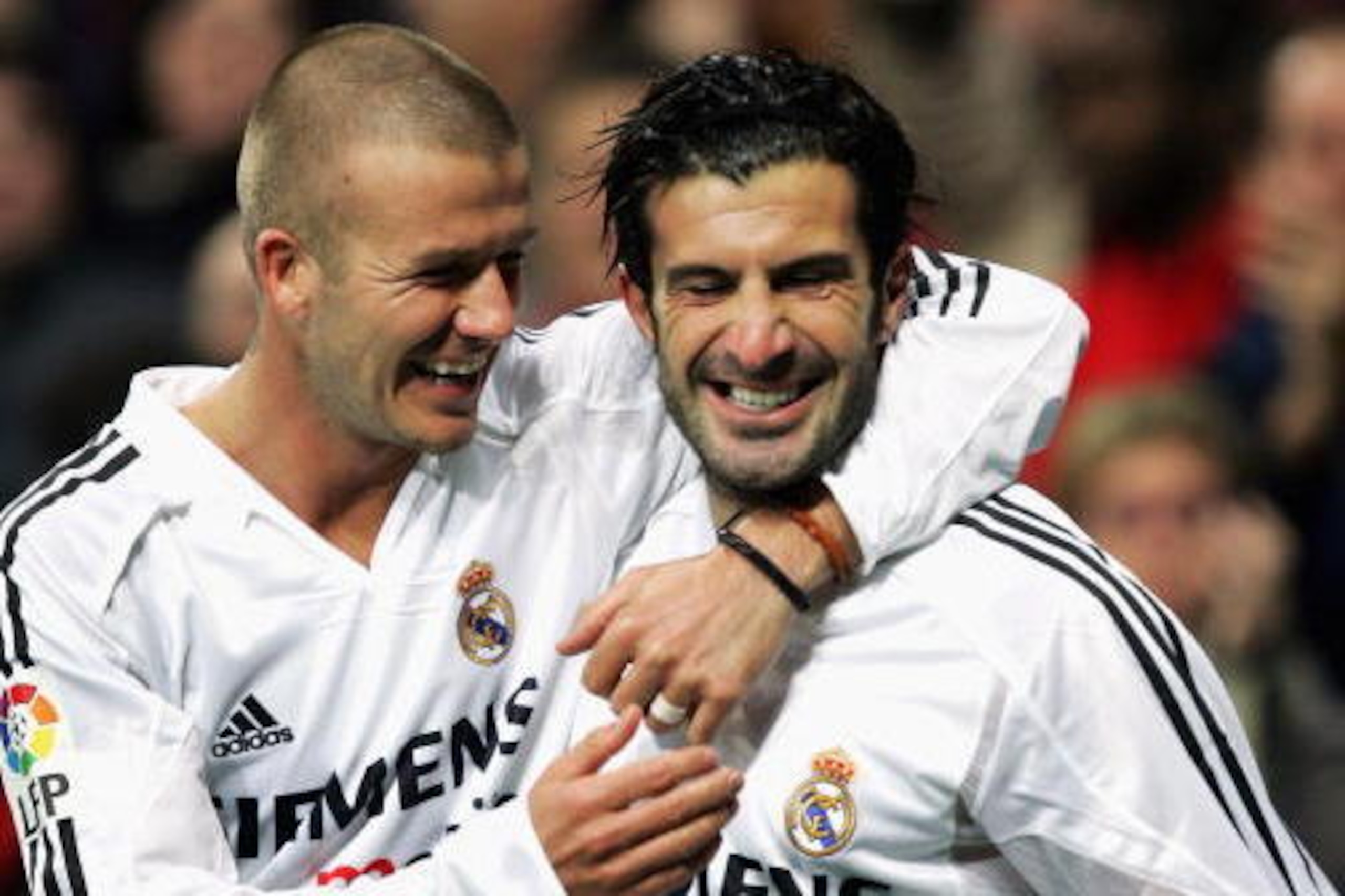 MADRID, SPAIN - NOVEMBER 28:  Real Madrid?s Luis Figo (R) celebrates with teammate David Beckham after he scored a goal against Levante during their la Liga match at the Bernabeu, November 28, 2004, in Madrid, Spain. (Photo by Denis Doyle/Getty Images)