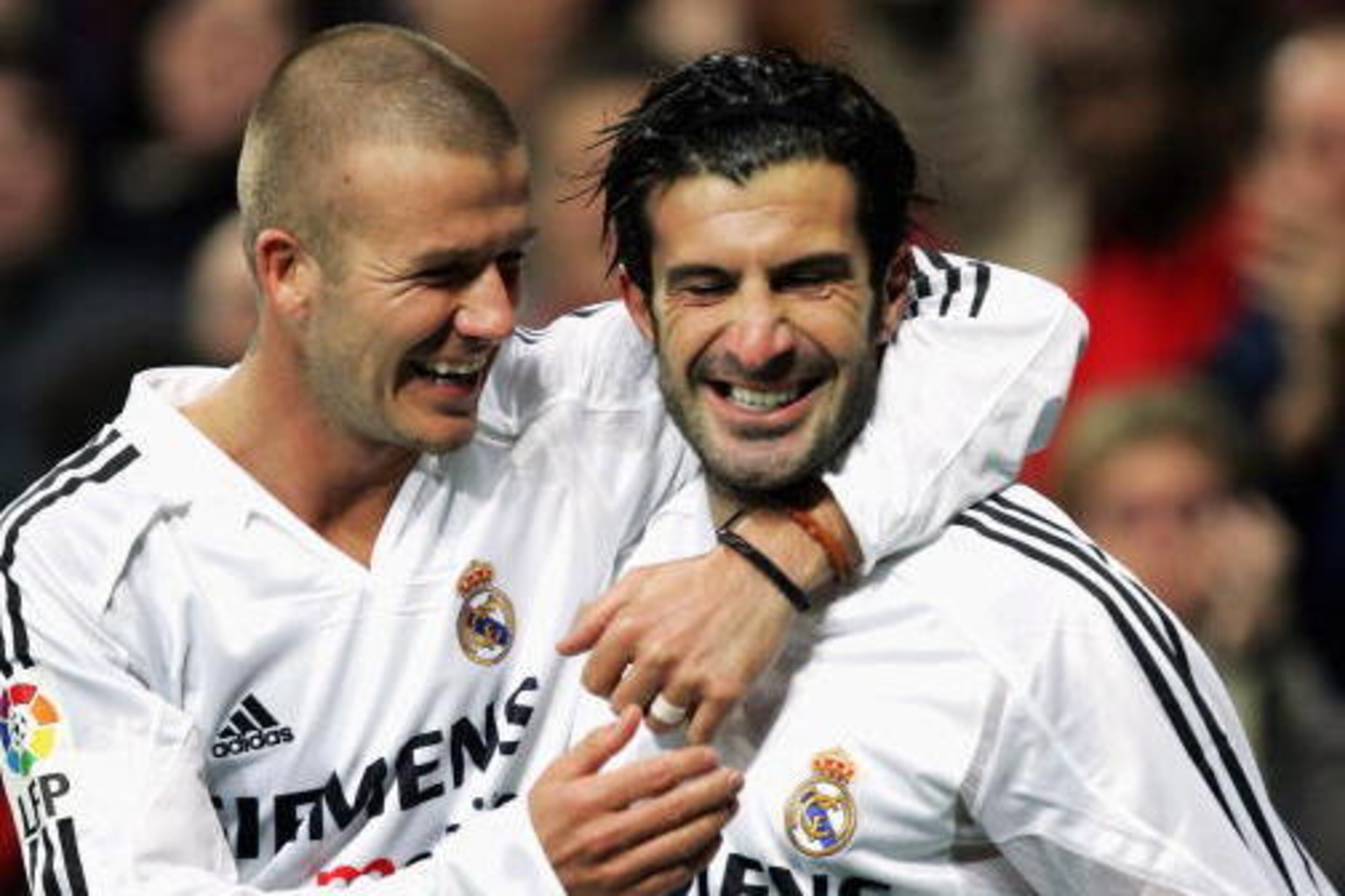 MADRID, SPAIN - NOVEMBER 28:  Real Madrid?s Luis Figo (R) celebrates with teammate David Beckham after he scored a goal against Levante during their la Liga match at the Bernabeu, November 28, 2004, in Madrid, Spain. (Photo by Denis Doyle/Getty Images)