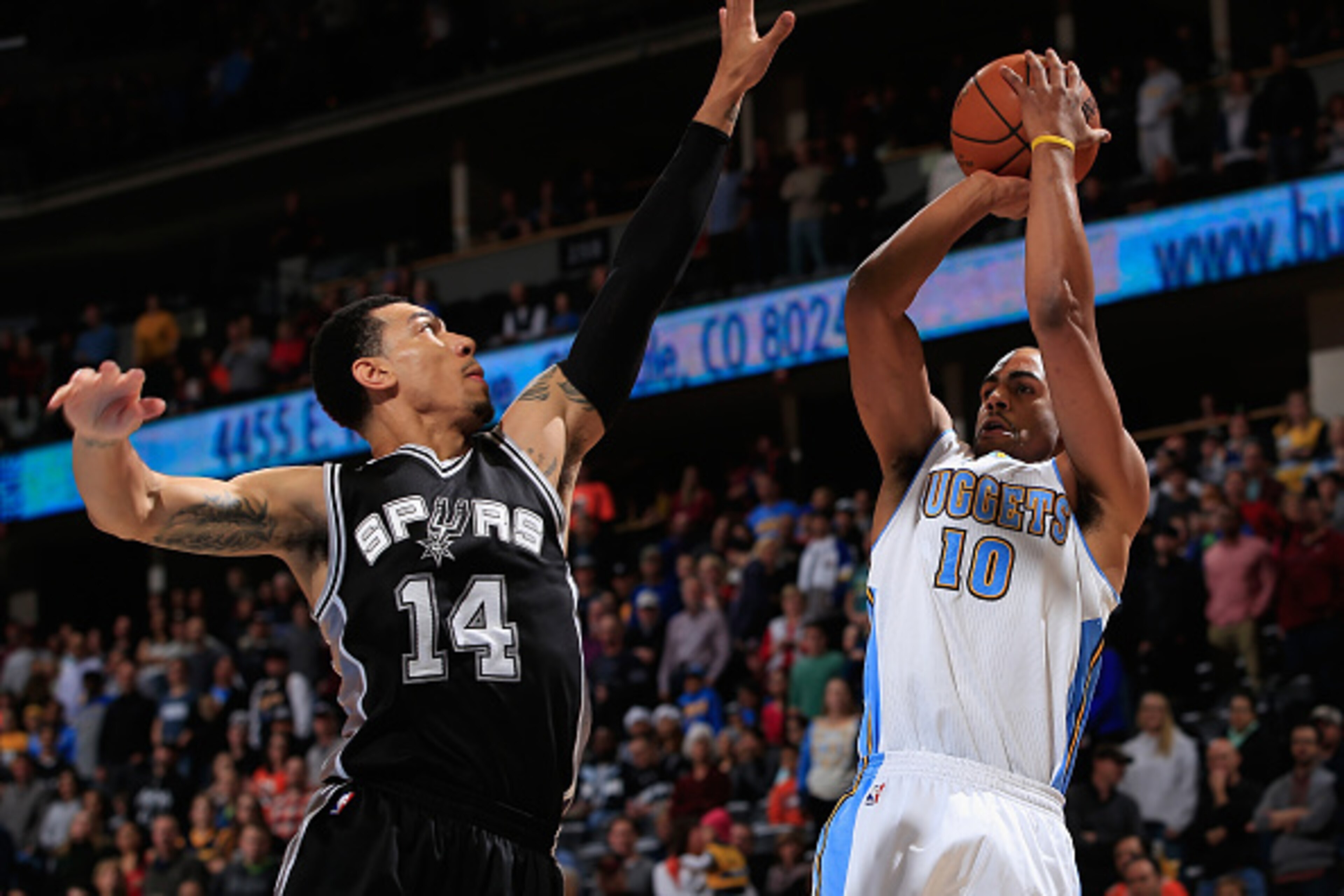 DENVER, CO - DECEMBER 14: Arron Afflalo #10 of the Denver Nuggets takes a shot against Danny Green #14 of the San Antonio Spurs at Pepsi Center on December 14, 2014 in Denver, Colorado. NOTE TO USER: User expressly acknowledges and agrees that, by downlo DENVER, CO - DECEMBER 14: Arron Afflalo #10 of the Denver Nuggets takes a shot against Danny Green #14 of the San Antonio Spurs at Pepsi Center on December 14, 2014 in Denver, Colorado. NOTE TO USER: User expressly acknowledges and agrees that, by downlo
