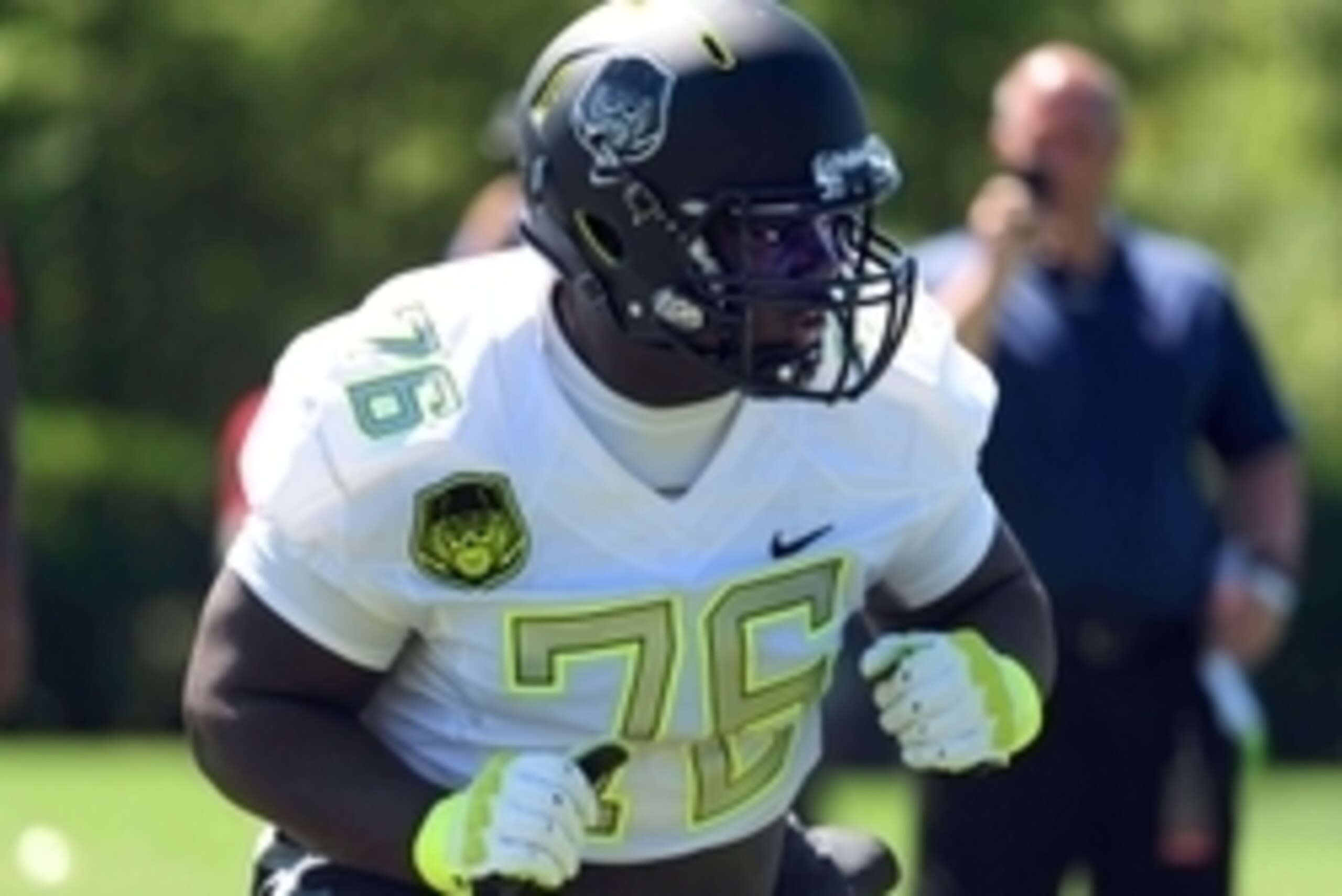 Jul 10, 2014; Beaverton, OR, USA; Offensive lineman Lester Cotton (76) goes through drills during Nike Football ' The Opening' at Nike World Headquarters.  Mandatory Credit: Steve Dykes-USA TODAY Sports