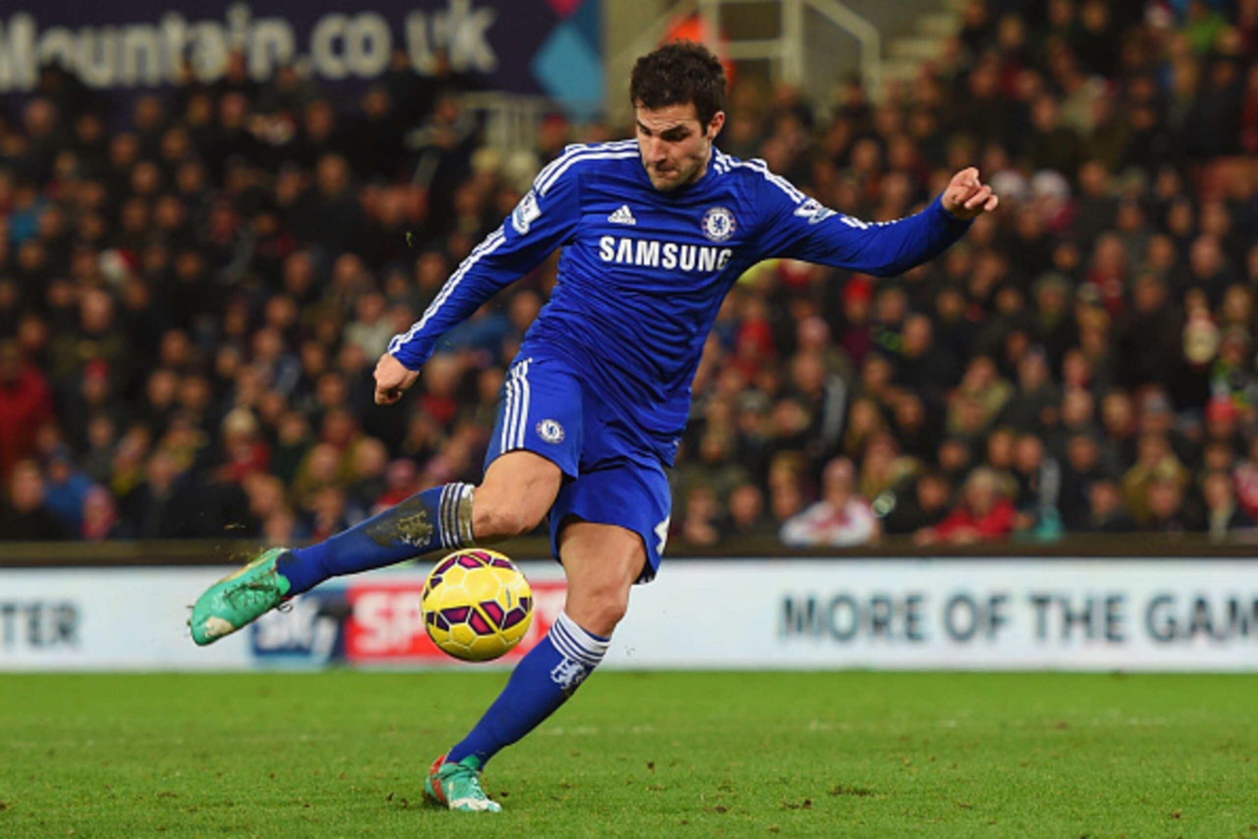 STOKE ON TRENT, ENGLAND - DECEMBER 22:  Cesc Fabregas of Chelsea scores their second goal during the Barclays Premier League match between Stoke City and Chelsea at Britannia Stadium on December 22, 2014 in Stoke on Trent, England.  (Photo by Michael Rega