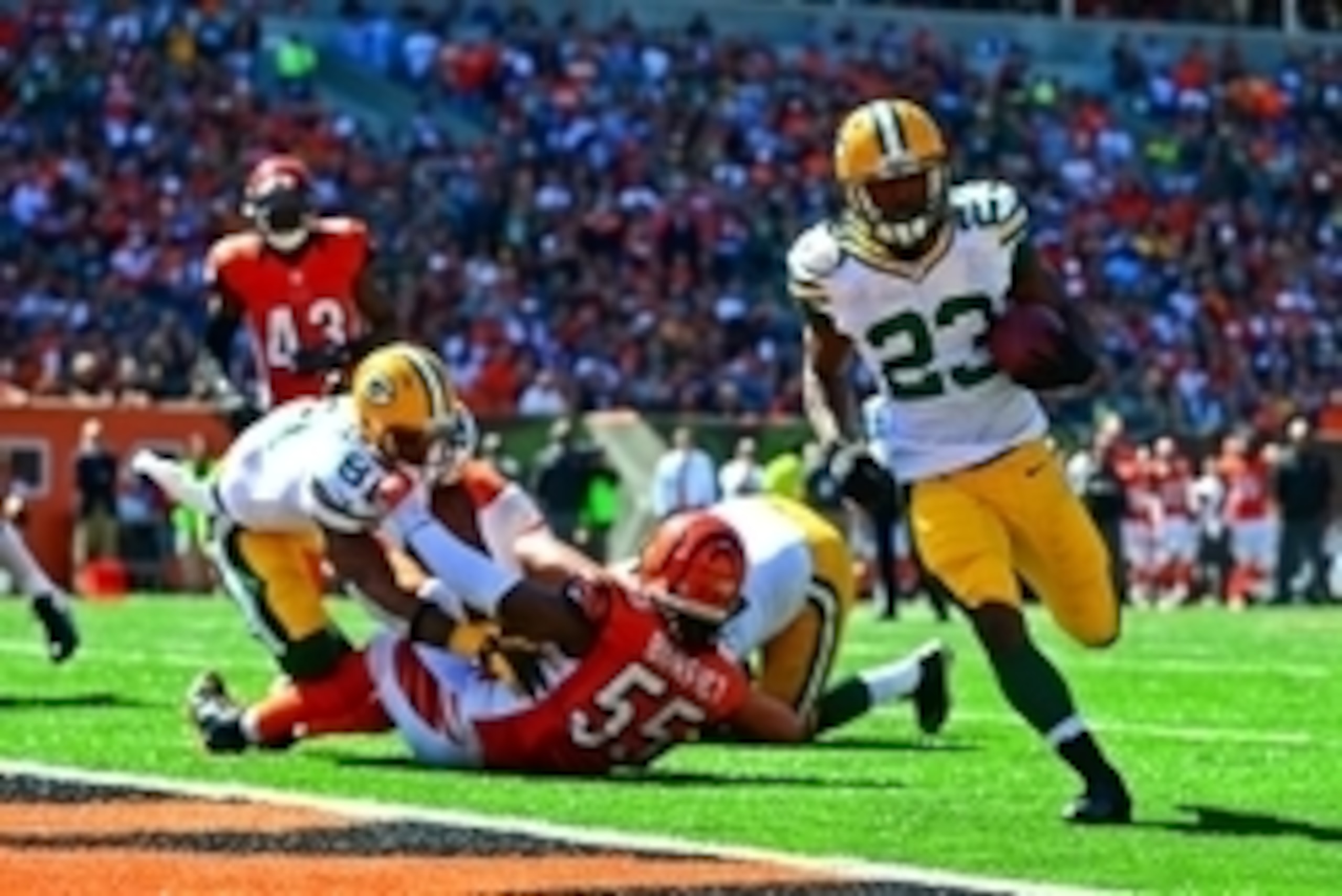 Sep 22, 2013; Cincinnati, OH, USA; Green Bay Packers running back Johnathan Franklin (23) rushes into the end zone for a touchdown during the third quarter against the Green Bay Packers at Paul Brown Stadium. Mandatory Credit: Andrew Weber-USA TODAY Sport