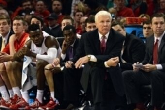Nov 22, 2014; Charlotte, NC, USA; Davidson Wildcats Bob McKillop (center) looks on during the first half as his team plays against the North Carolina Tar Heels at Time Warner Cable Arena. Mandatory Credit:  Rob Kinnan-USA Today.