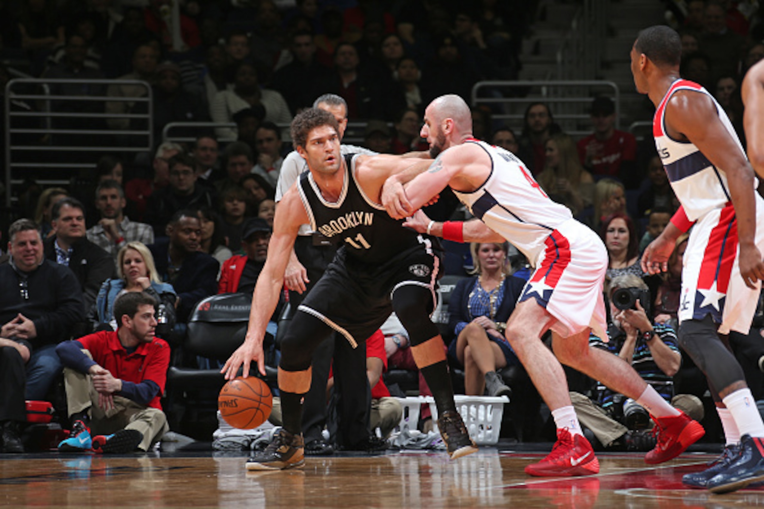 WASHINGTON, DC -  FEBRUARY 7:  Brook Lopez #11 of the Brooklyn Nets posts up against Marcin Gortat #4 of the Washington Wizards during the game on February 7, 2015 at Verizon Center in Washington, DC. NOTE TO USER: User expressly acknowledges and agrees t
