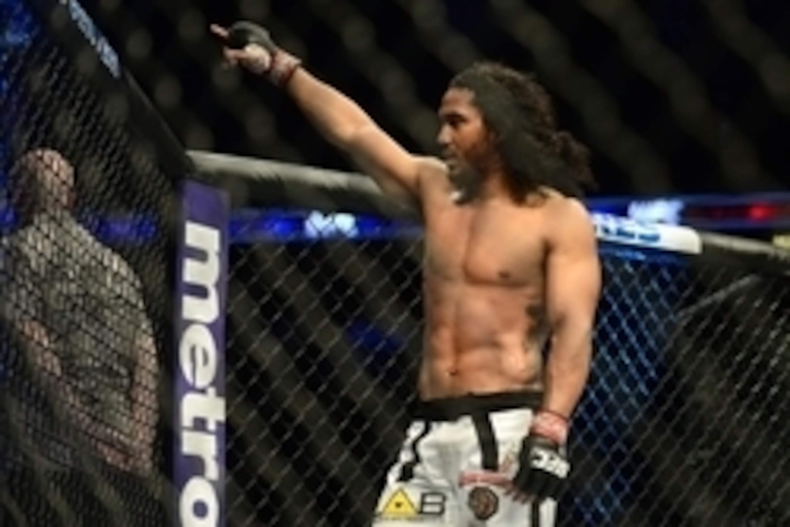 Feb 14, 2015; Broomfield, CO, USA; Benson Henderson (red) celebrates his win over Brandon Thatch (not pictured) following the welterweight bout at the UFC Fight Night at the 1stBANK Center. Mandatory Credit: Ron Chenoy-USA TODAY Sports