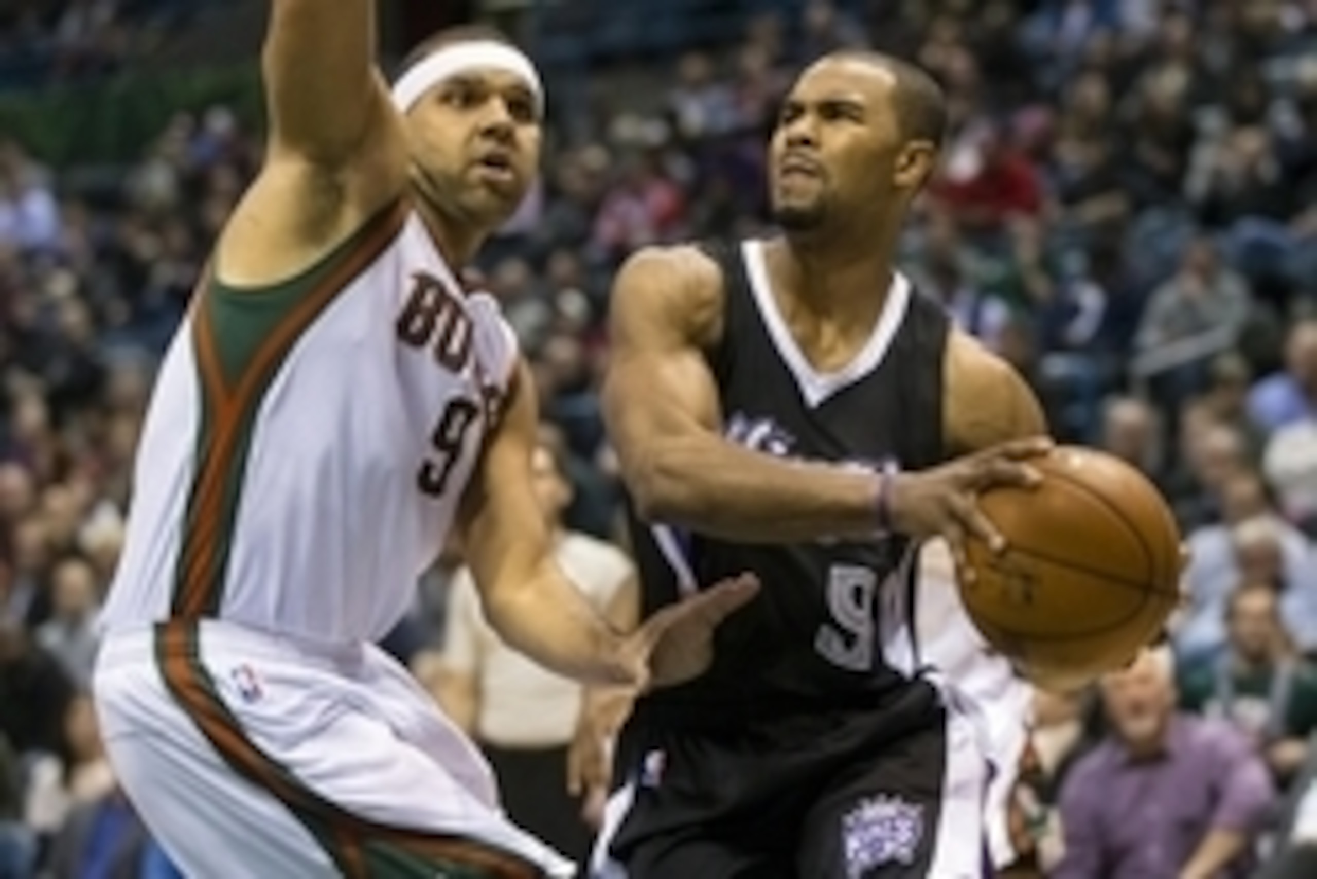 Feb 11, 2015; Milwaukee, WI, USA; Sacramento Kings guard Ramon Sessions (9) looks to pass the ball around Milwaukee Bucks guard Jared Dudley (9) during the second quarter at BMO Harris Bradley Center. Mandatory Credit: Jeff Hanisch-USA TODAY Sports