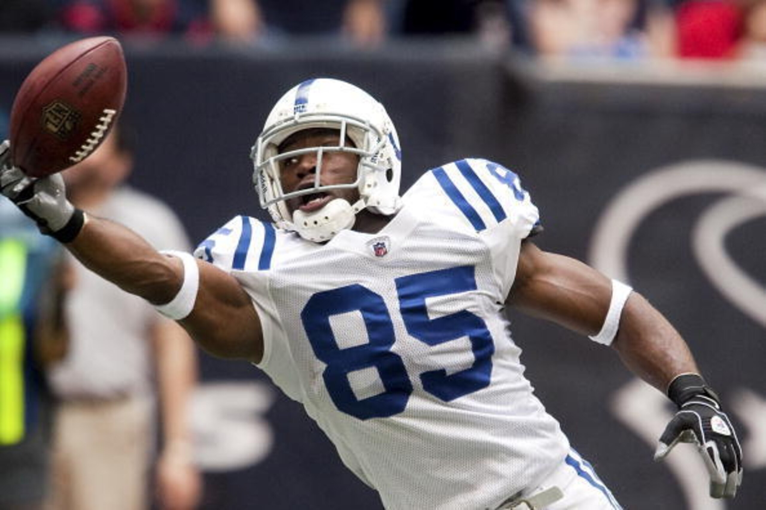 HOUSTON - NOVEMBER 29:  Wide receiver Pierre Garcon #85 of the Indianapolis Colts makes a one-handed catch in the end-zone for a touchdown against the Houston Texans at Reliant Stadium on November 29, 2009 in Houston, Texas.  (Photo by Bob Levey/Getty Ima
