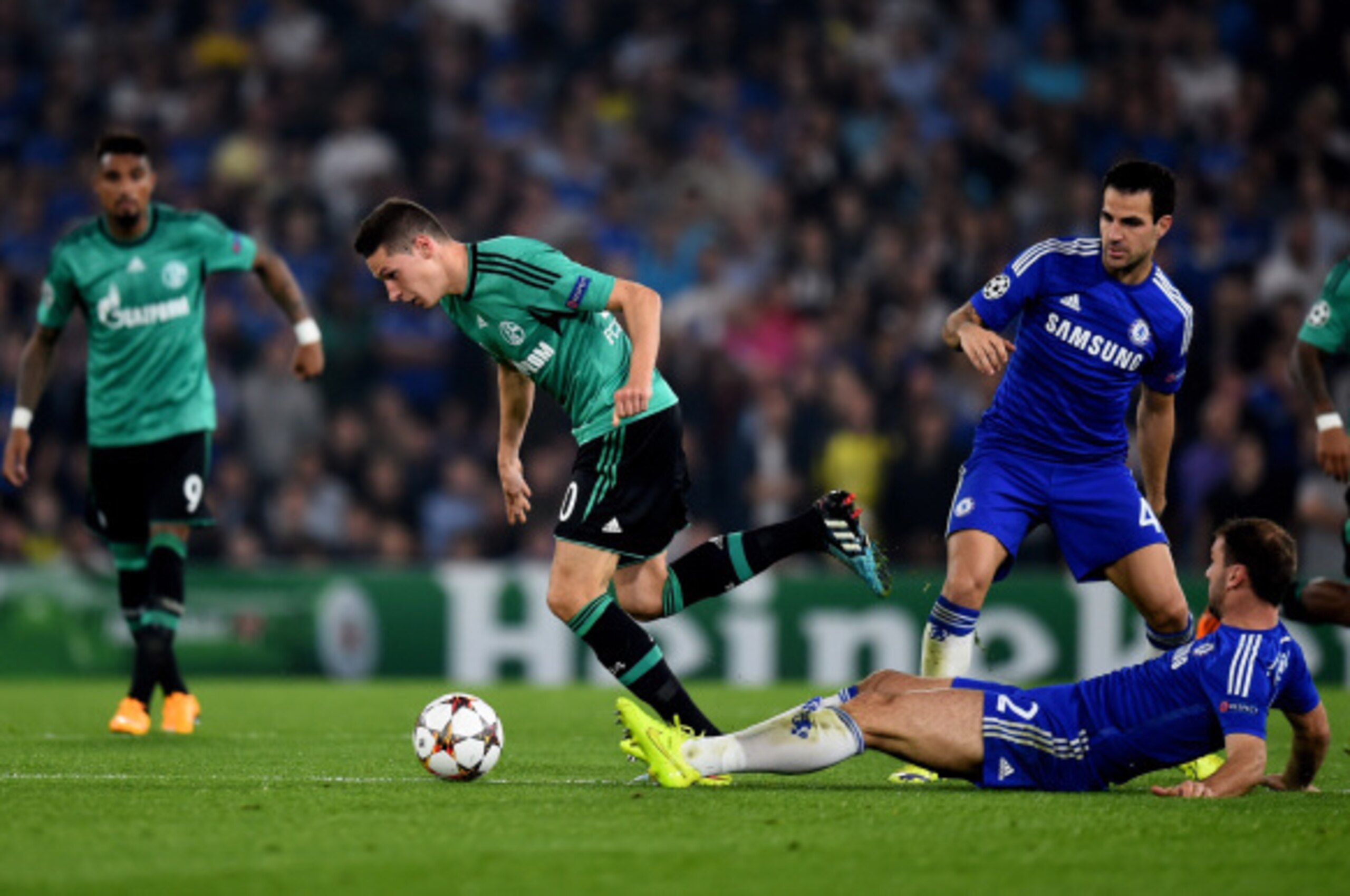 LONDON, ENGLAND - SEPTEMBER 17:  Julian Draxler of Schalke goes past Branislav Ivanovic of Chelsea during the UEFA Champions League Group G match between Chelsea and FC Schalke 04 on September 17, 2014 in London, United Kingdom.  (Photo by Mike Hewitt/Get