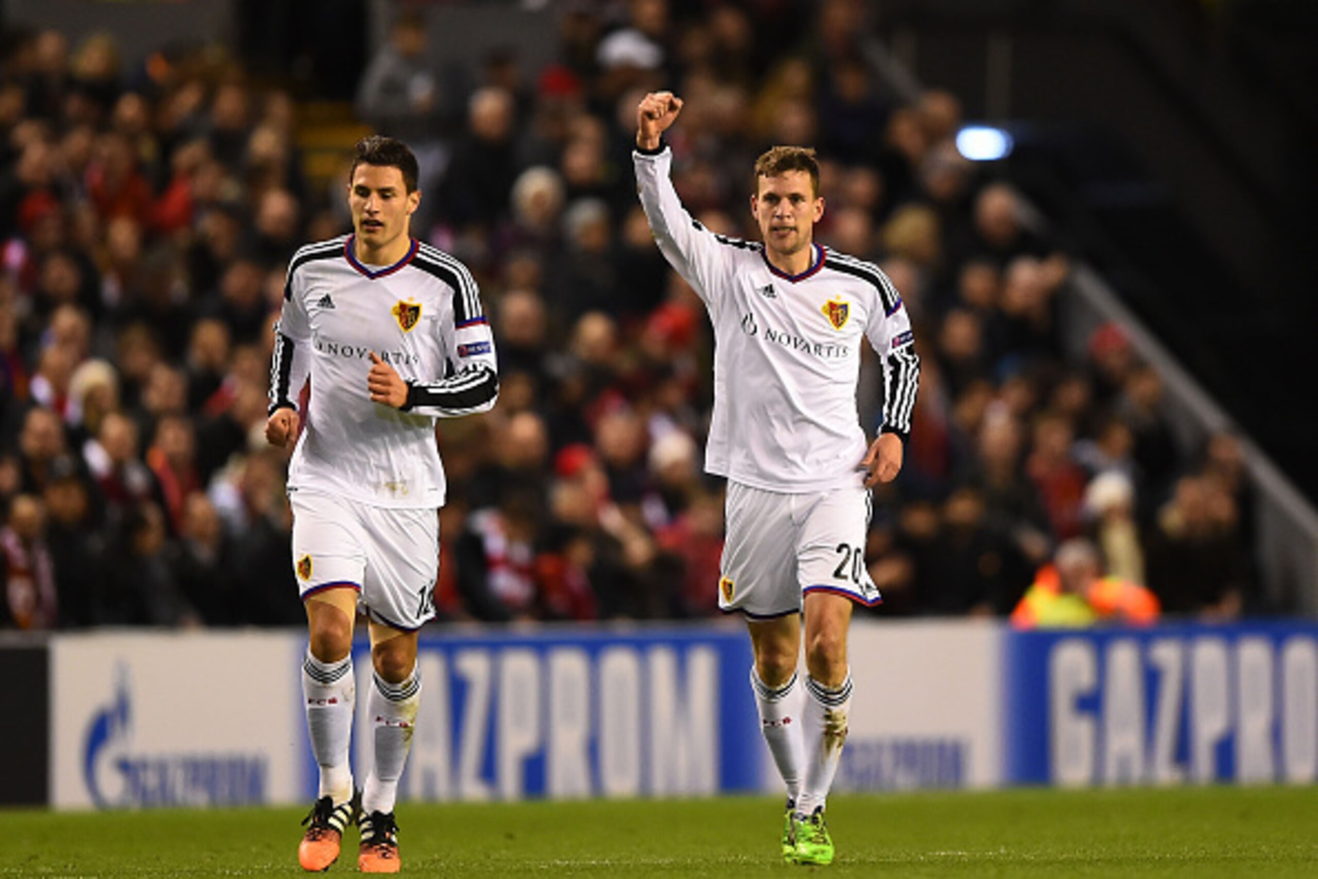 LIVERPOOL, ENGLAND - DECEMBER 09:  Fabian Frei (R) of FC Basel celebrates after scoring the opening goal during the UEFA Champions League group B match between Liverpool and FC Basel 1893 at Anfield on December 9, 2014 in Liverpool, United Kingdom.  (Phot