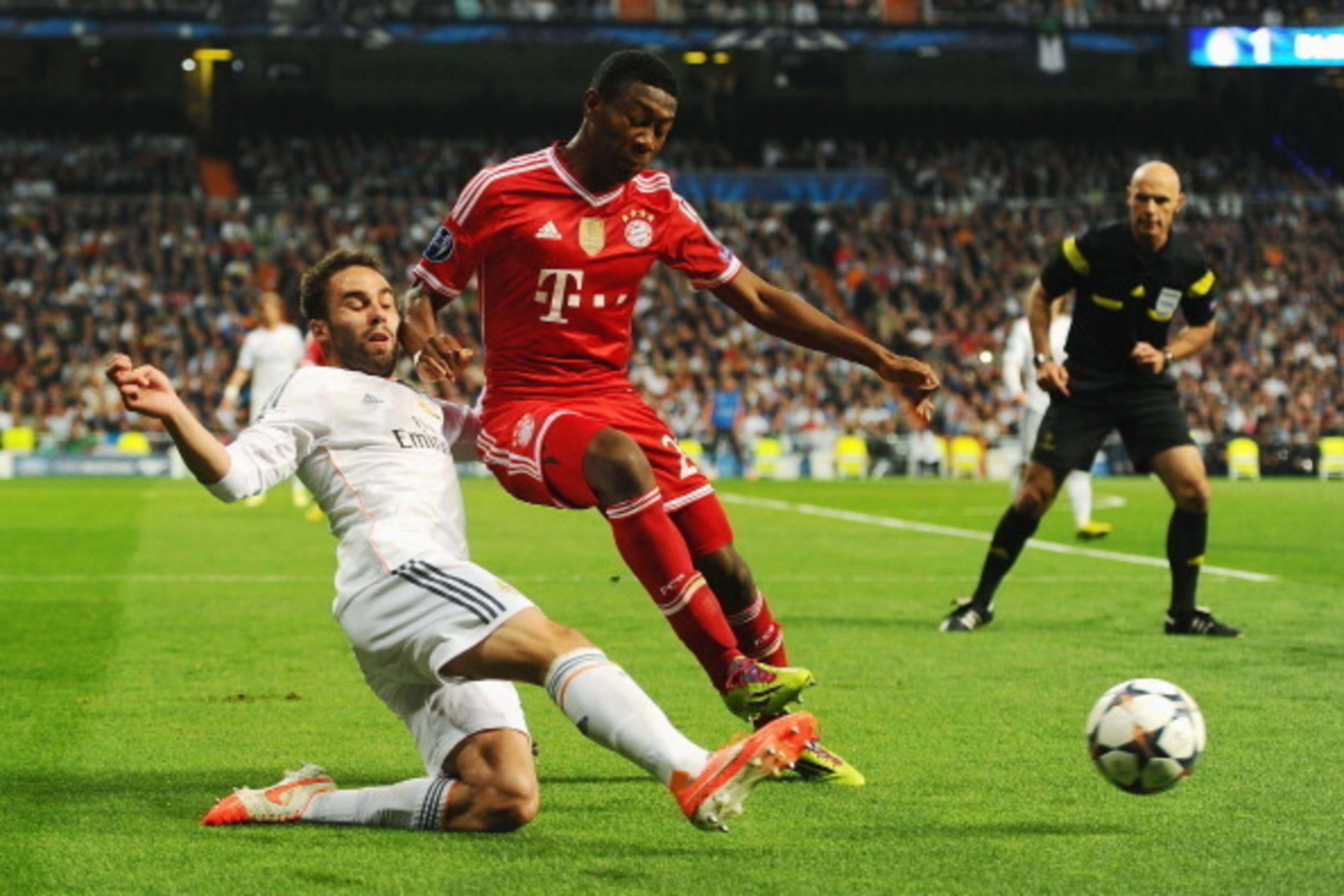 MADRID, SPAIN - APRIL 23: David Alaba of Bayern Muenchen is challenged by Daniel Carvajal of Real Madrid during the UEFA Champions League semi-final first leg match between Real Madrid and FC Bayern Muenchen at the Estadio Santiago Bernabeu on April 23, 2 MADRID, SPAIN - APRIL 23: David Alaba of Bayern Muenchen is challenged by Daniel Carvajal of Real Madrid during the UEFA Champions League semi-final first leg match between Real Madrid and FC Bayern Muenchen at the Estadio Santiago Bernabeu on April 23, 2