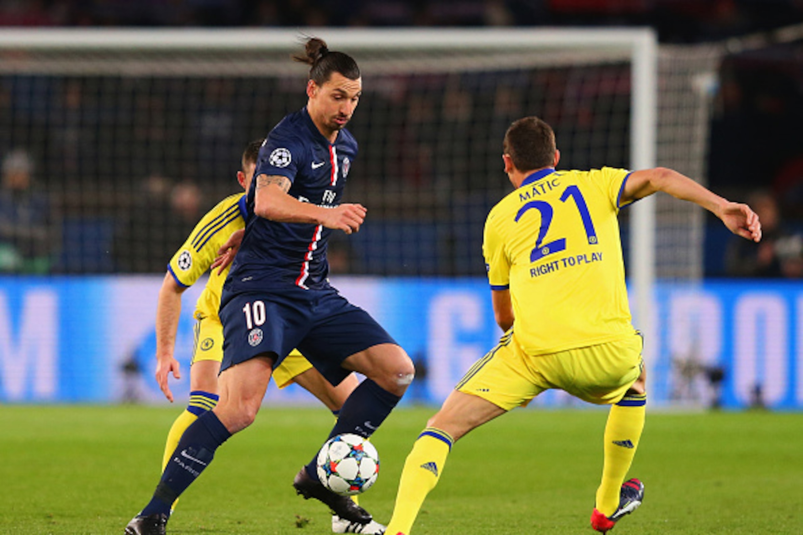 PARIS, FRANCE - FEBRUARY 17:  Zlatan Ibrahimovic of Paris Saint-Germain takes on Nemanja Matic of Chelsea during the UEFA Champions League Round of 16 match between Paris Saint-Germain and Chelsea at Parc des Princes on February 17, 2015 in Paris, France.