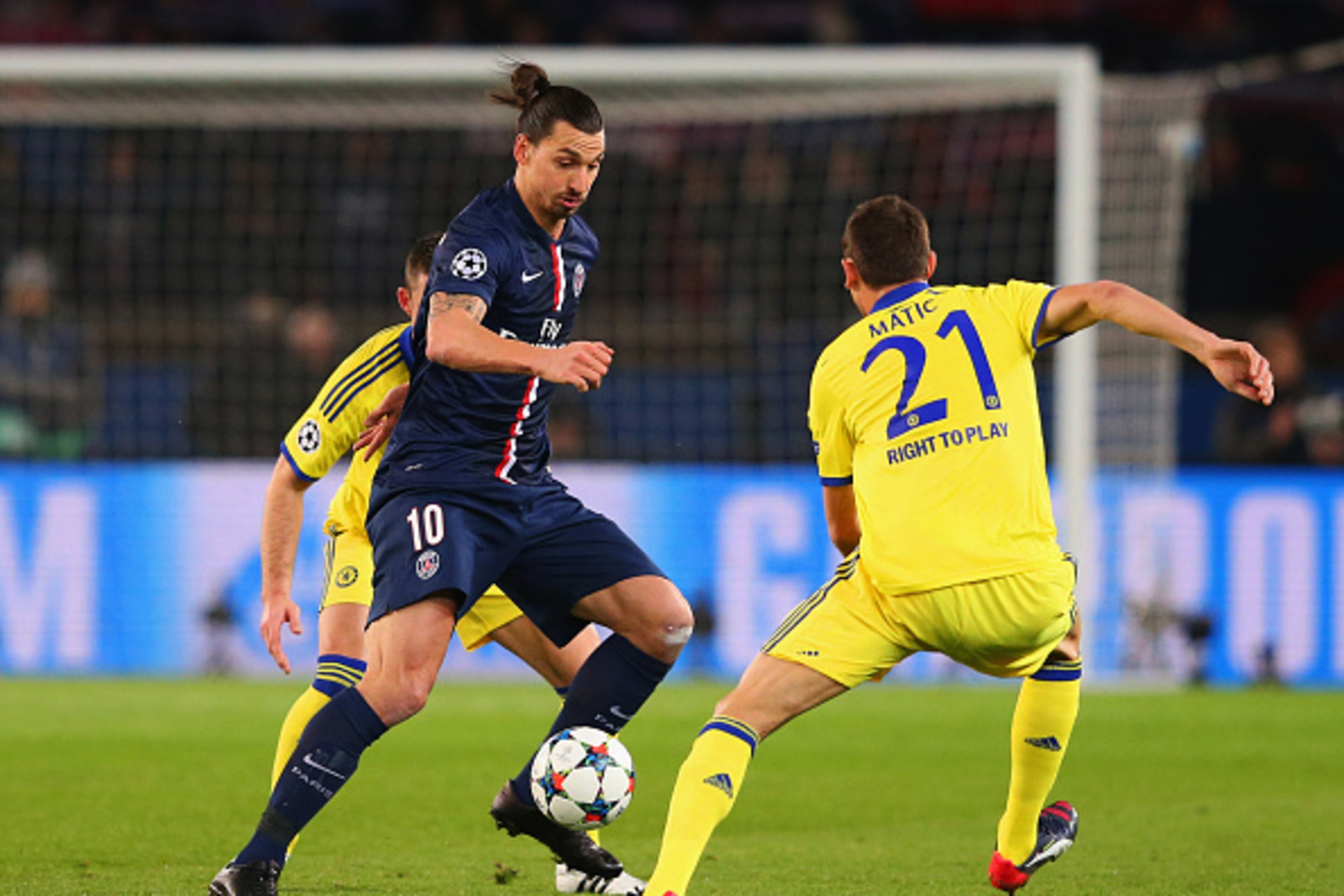 PARIS, FRANCE - FEBRUARY 17:  Zlatan Ibrahimovic of Paris Saint-Germain takes on Nemanja Matic of Chelsea during the UEFA Champions League Round of 16 match between Paris Saint-Germain and Chelsea at Parc des Princes on February 17, 2015 in Paris, France.