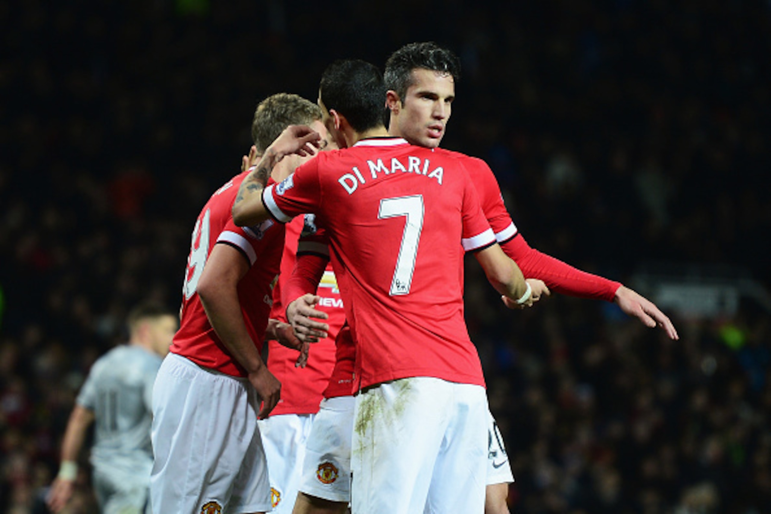 MANCHESTER, ENGLAND - FEBRUARY 11: Robin van Persie of Manchester United celebrates scoring his penalty with team mate Angel Di Maria during the Barclays Premier League match between Manchester United and Burnley at Old Trafford on February 11, 2015 in M MANCHESTER, ENGLAND - FEBRUARY 11: Robin van Persie of Manchester United celebrates scoring his penalty with team mate Angel Di Maria during the Barclays Premier League match between Manchester United and Burnley at Old Trafford on February 11, 2015 in M