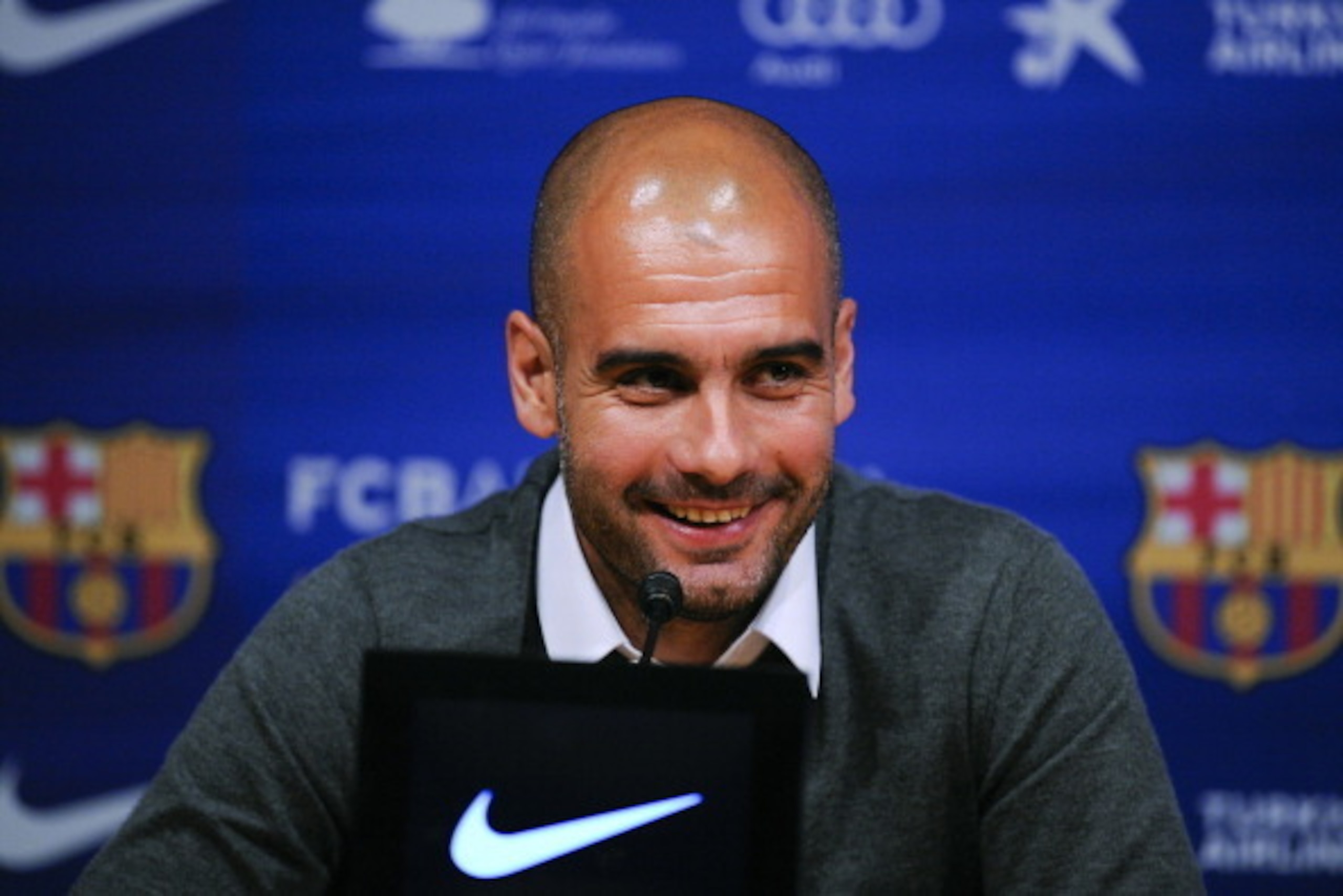 BARCELONA, SPAIN - APRIL 27:  Head coach Josep Guardiola of FC Barcelona smiles during the press conference at the Camp Nou stadium on April 27, 2012 in Barcelona, Spain. Josep Guardiola has today announced he is not renewing his contract after a 4 year t
