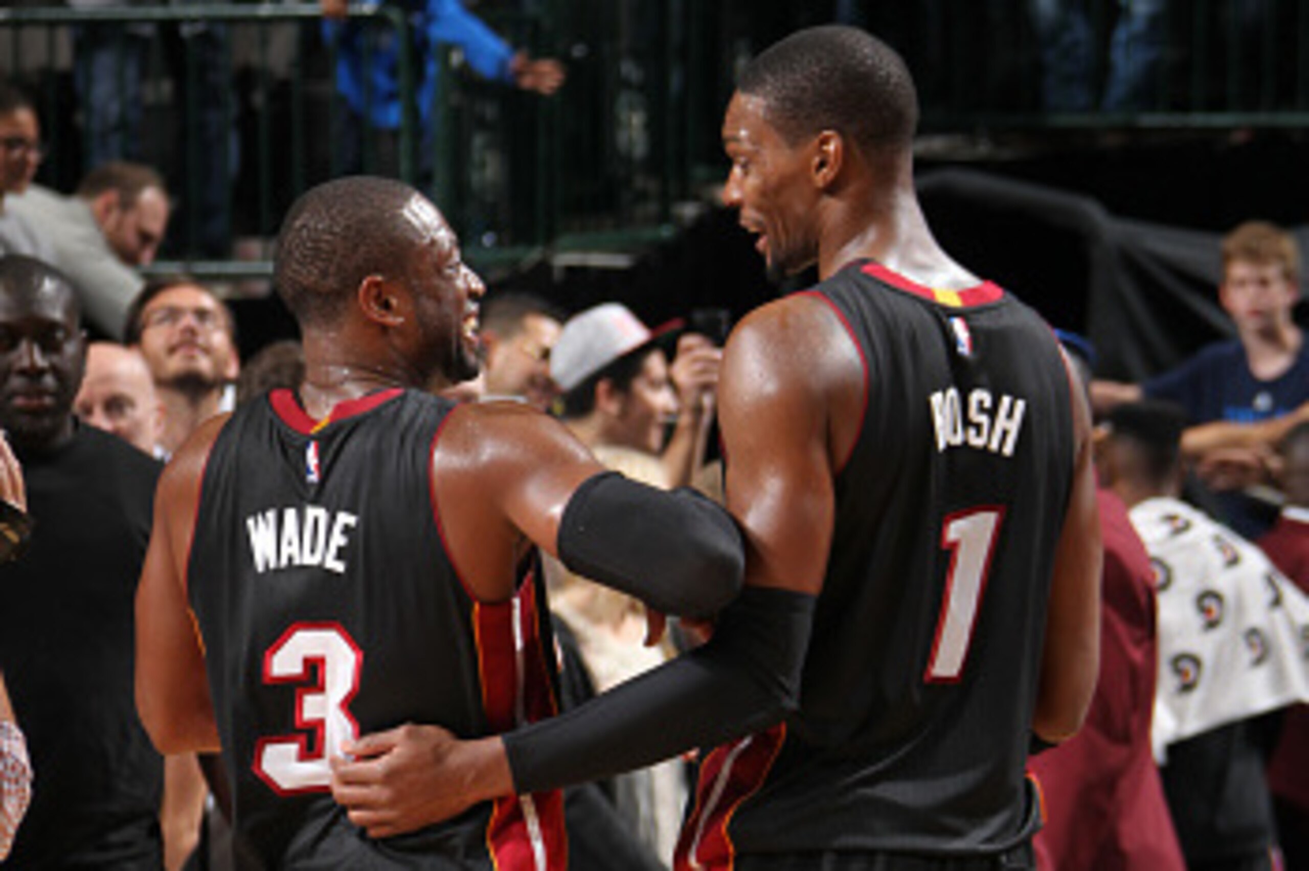 DALLAS, TX - NOVEMBER 9: Chris Bosh #1 and Dwyane Wade #3 of the Miami Heat celebrate a win against the Dallas Mavericks on November 9, 2014 at the American Airlines Center in Dallas, Texas. NOTE TO USER: User expressly acknowledges and agrees that, by do