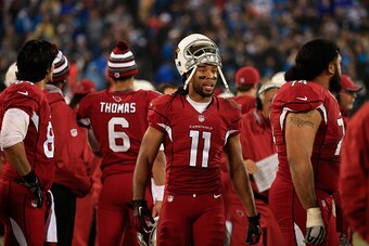 CHARLOTTE, NC - JANUARY 03:  Larry Fitzgerald #11 of the Arizona Cardinals encourages his teammates against the Carolina Panthers in the 2nd half during their NFC Wild Card Playoff game at Bank of America Stadium on January 3, 2015 in Charlotte, North Car