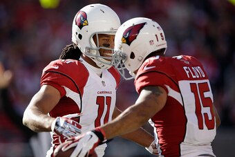SANTA CLARA, CA - DECEMBER 28: Larry Fitzgerald #11 of the Arizona Cardinals celebrates a first quarter touchdown with Michael Floyd #15 of the Arizona Cardinals against the San Francisco 49ers at Levi's Stadium on December 28, 2014 in Santa Clara, Califo