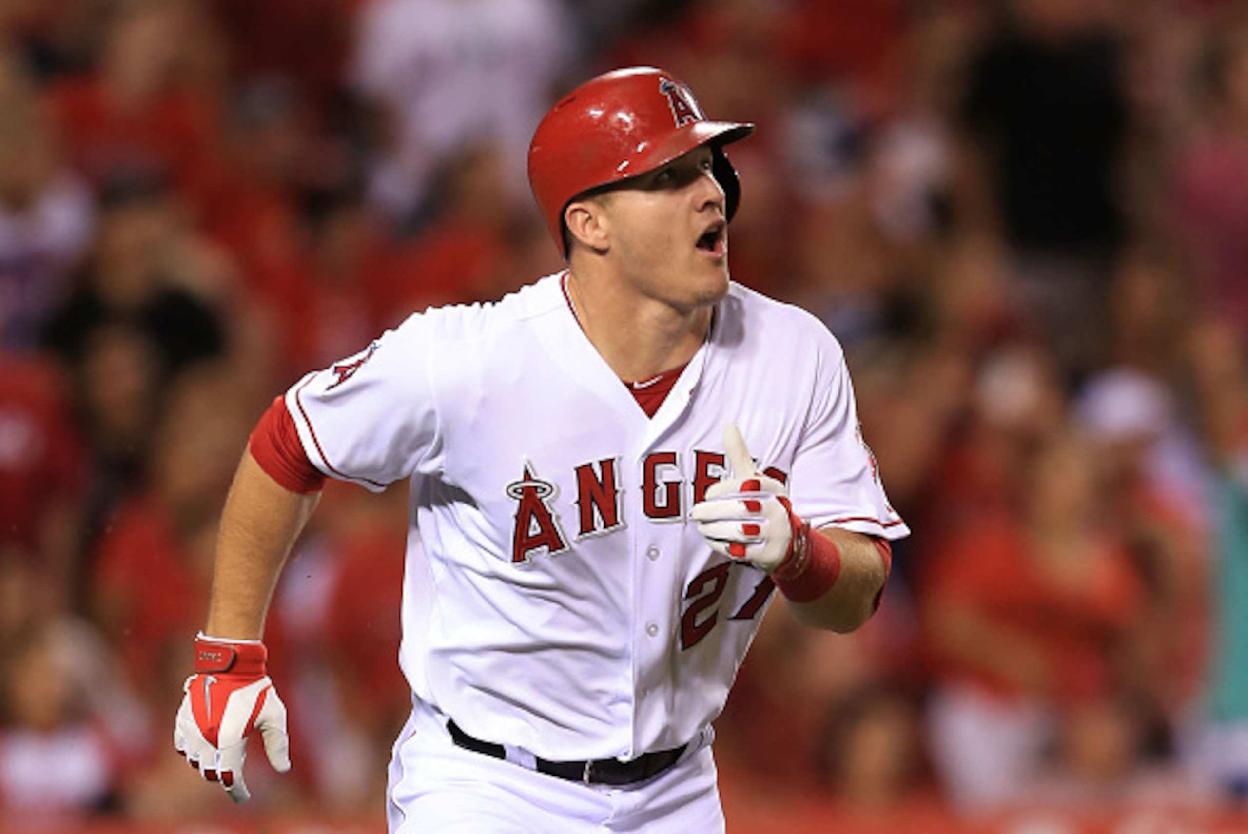 ANAHEIM, CA - SEPTEMBER 20: Mike Trout #27 of the Los Angeles Angels of Anaheim watches his hit for a triple go to the right center field in the fifth inning during the MLB game against the Texas Rangers at Angel Stadium of Anaheim on September 20, 2014 i