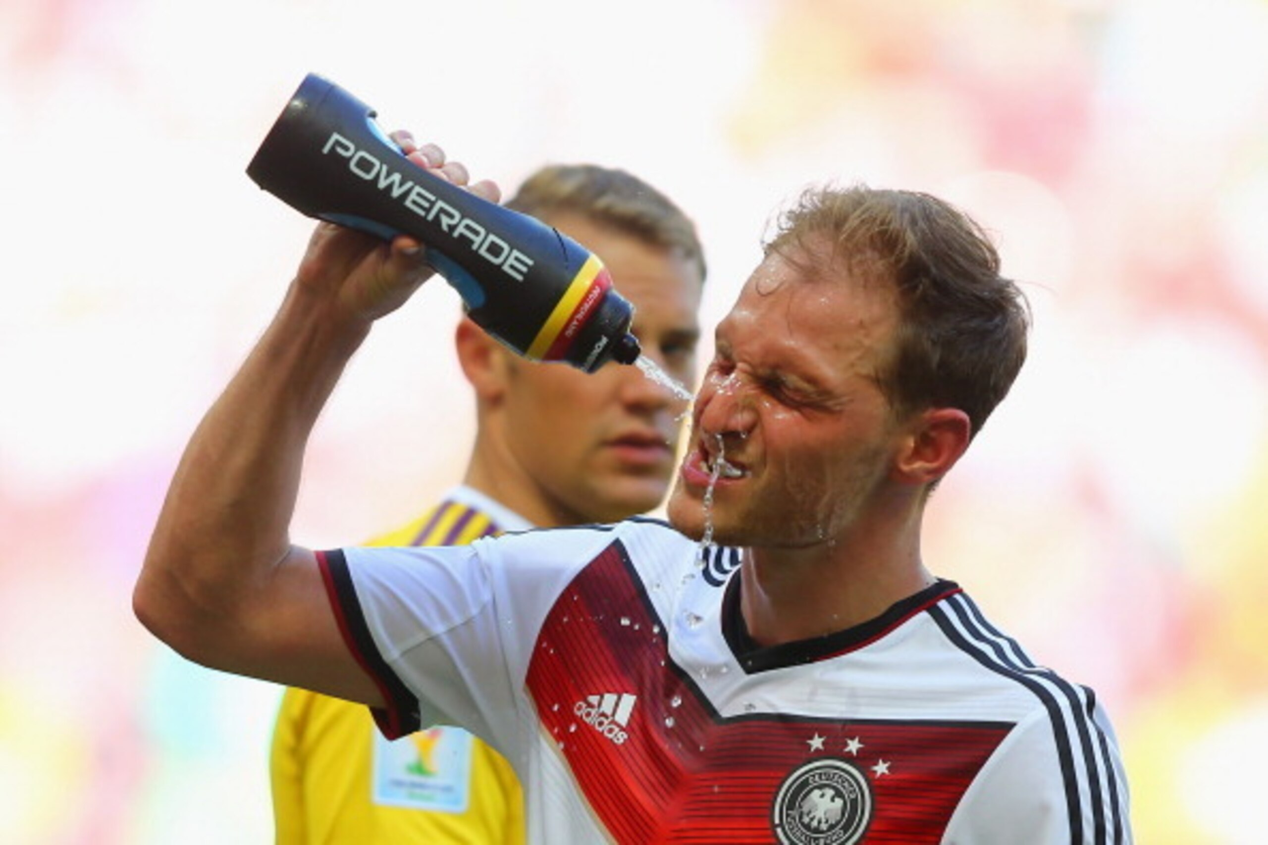 SALVADOR, BRAZIL - JUNE 16:  Benedikt Hoewedes of Germany takes a drink during the 2014 FIFA World Cup Brazil Group G match between Germany and Portugal at Arena Fonte Nova on June 16, 2014 in Salvador, Brazil.  (Photo by Martin Rose/Getty Images)