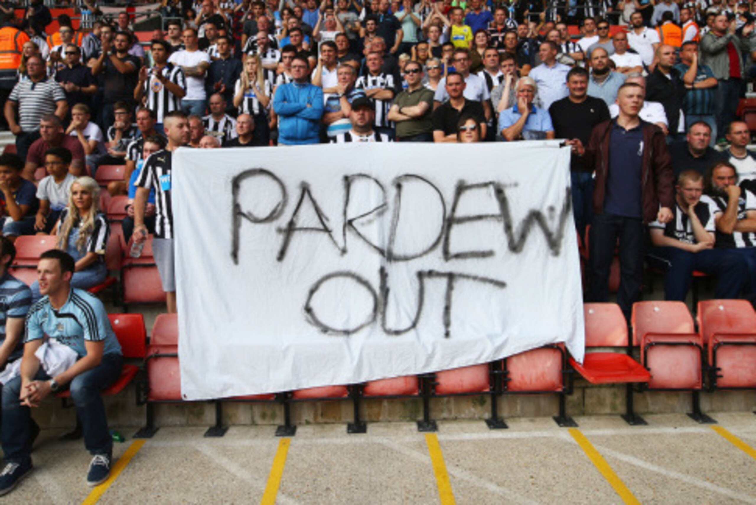 SOUTHAMPTON, ENGLAND - SEPTEMBER 13:  Newcastle United fans hold a 'Pardew Out' banner during the Barclays Premier League match between Southampton and Newcastle United at St Mary's Stadium on September 13, 2014 in Southampton, England.  (Photo by Richard